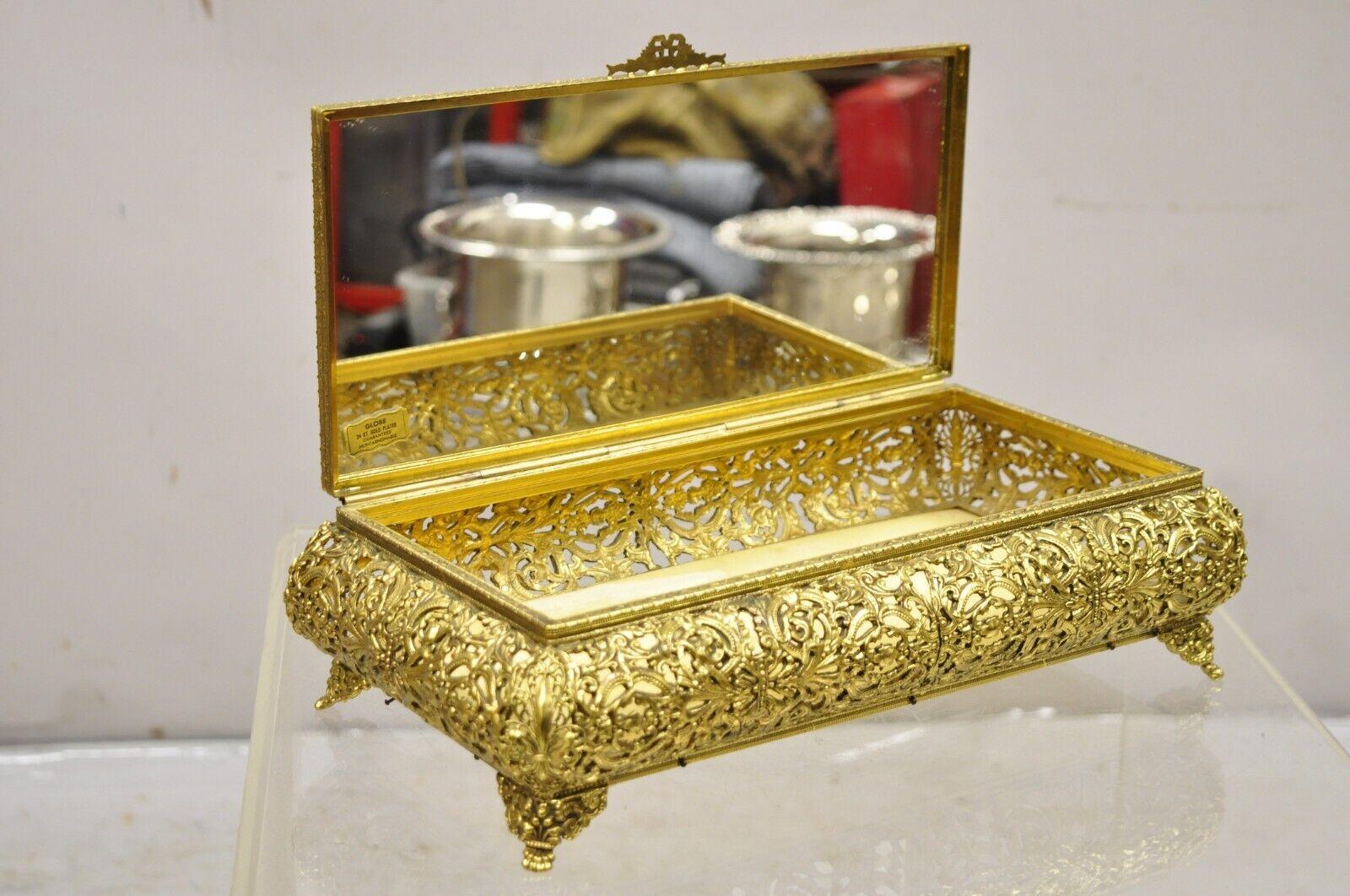 Vintage French Hollywood Regency Style Gold Filigree Vanity Jewelry Box by Globe. Item featured is 24kt gold plated, hinged lid, felt lining, interior mirror, very nice vintage item. Circa Mid to Late 20th Century. Measurements: 4