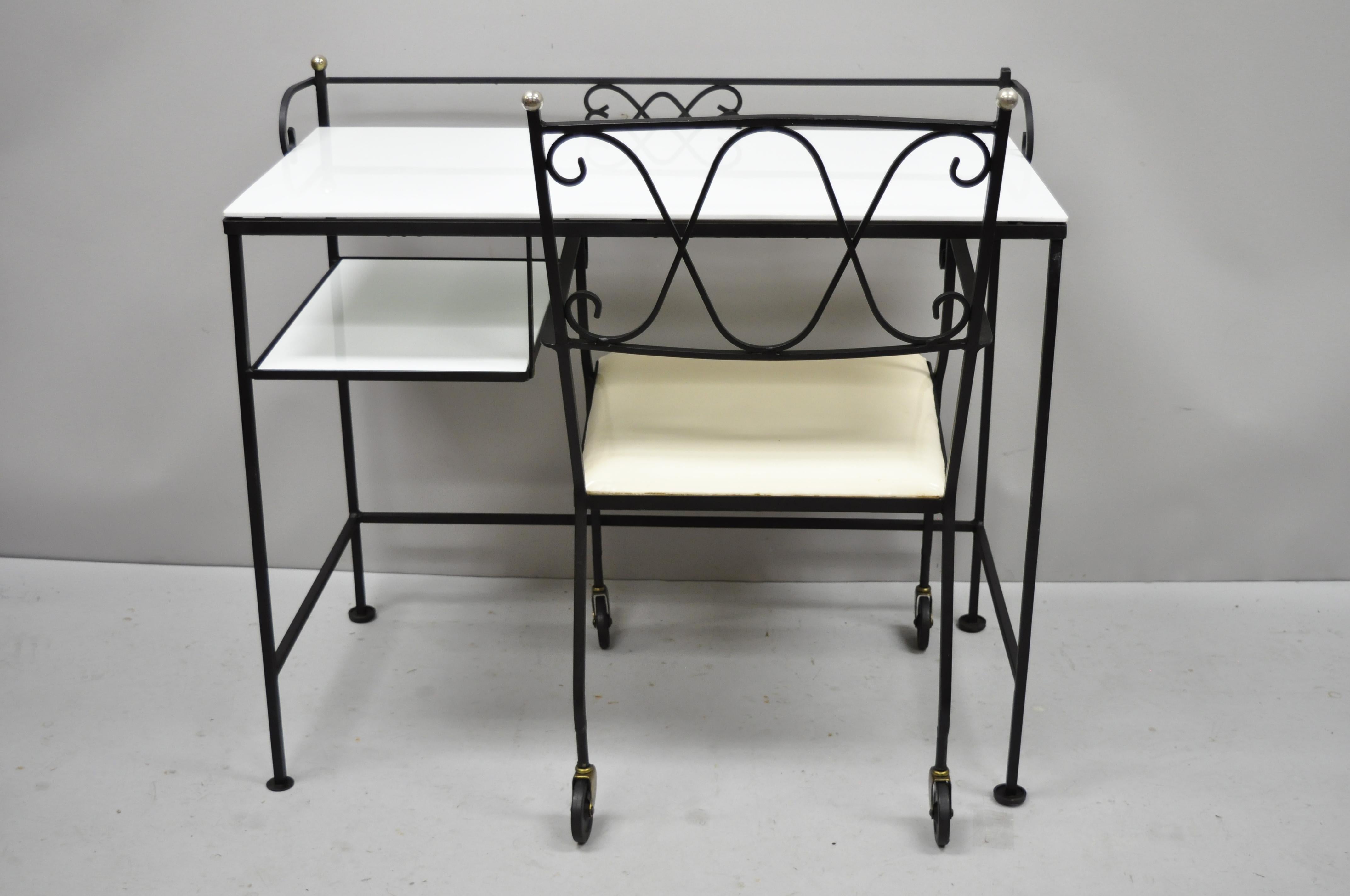 Vintage Gallo original iron works wrought iron Salterini style desk and chair with vitrolite glass. Item features wrought iron frame, white Vitrolite glass top and lower shelf, ball finials, wheels on chair, original label to chair, clean modernist