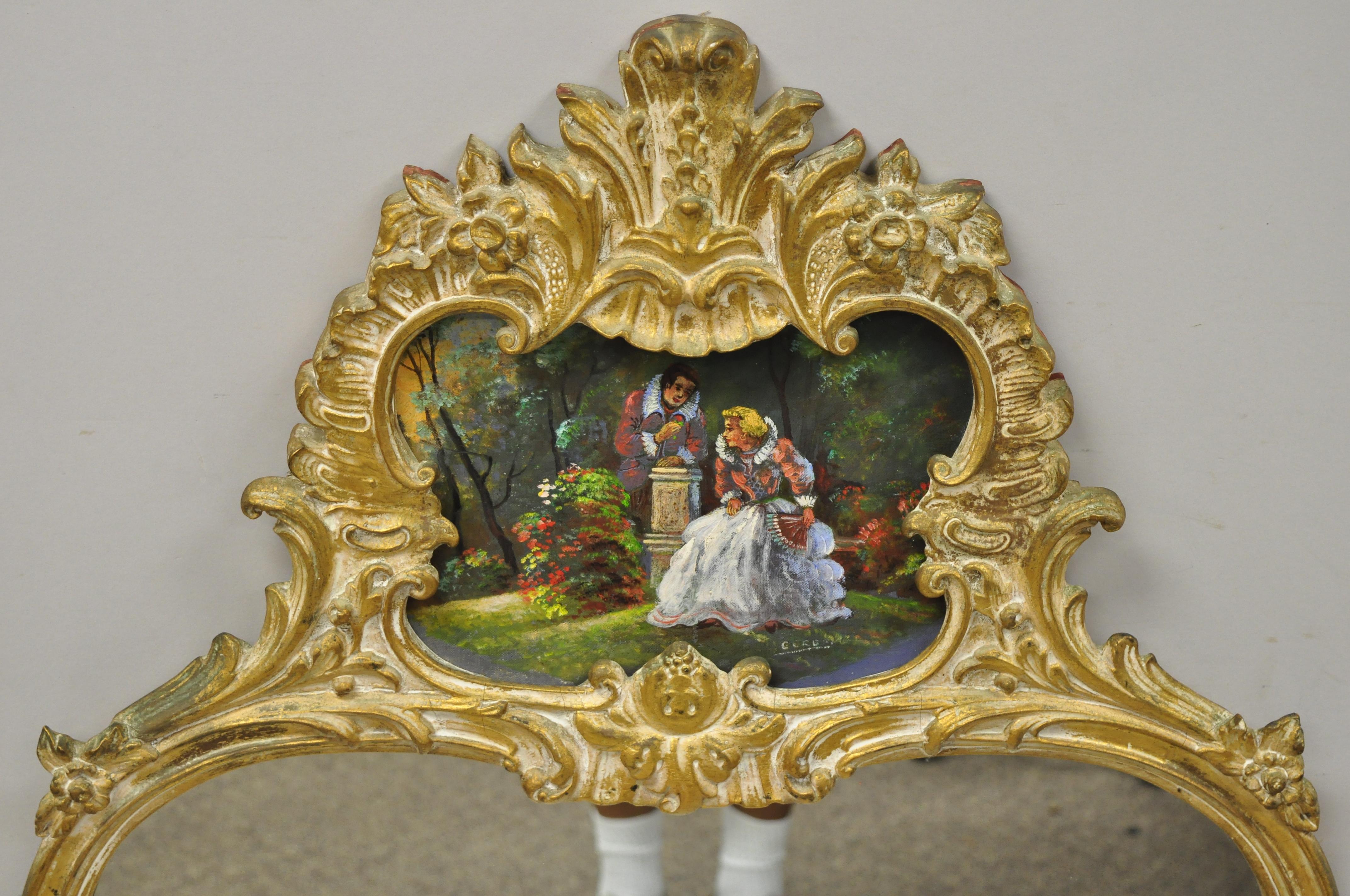 Vintage gold giltwood French Victorian style wall mirror with painted courting scene. Item features a gold giltwood frame, painted courting scene to crest, very nice vintage item, great style and form, circa mid-20th century. Measurements: 50
