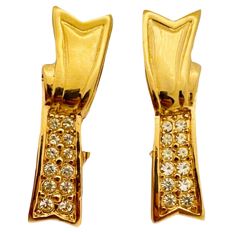 Vtg gold rhinestone designer runway clip on earrings For Sale at 1stDibs