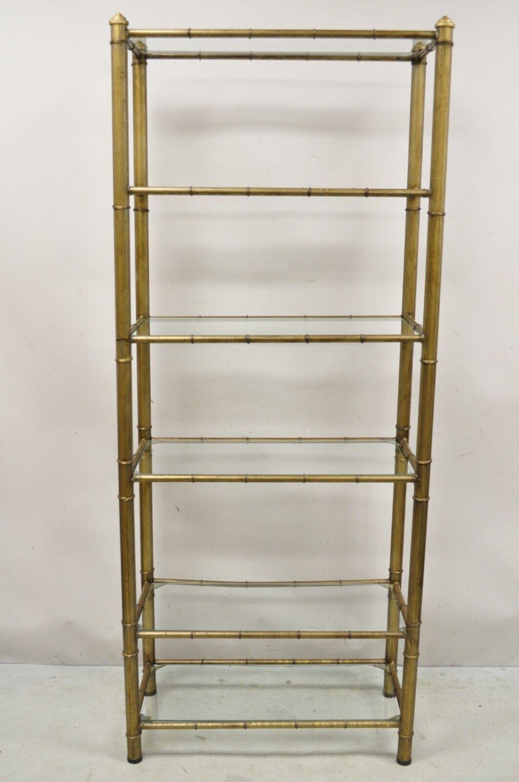 Vintage Hollywood Regency Faux Bamboo Steel Metal Gold 6 Tier Etagere Shelf Bookcase. Item features steel metal faux bamboo design frame, 6 glass shelves, dark gold distress painted finish, very nice vintage item, great style and form. Circa Mid