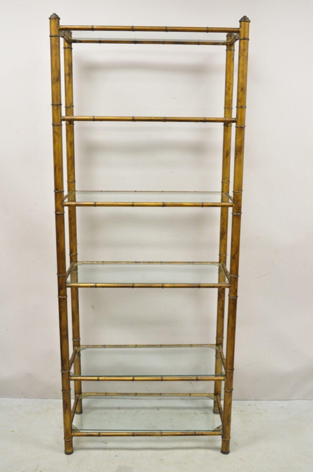 Vintage Hollywood Regency Faux Bamboo Steel Metal Gold 6 Tier Etagere Shelf Bookcase. Item features a steel metal faux bamboo design frame, 6 glass shelves, dark gold distress painted finish, very nice vintage item, great style and form. Circa Mid