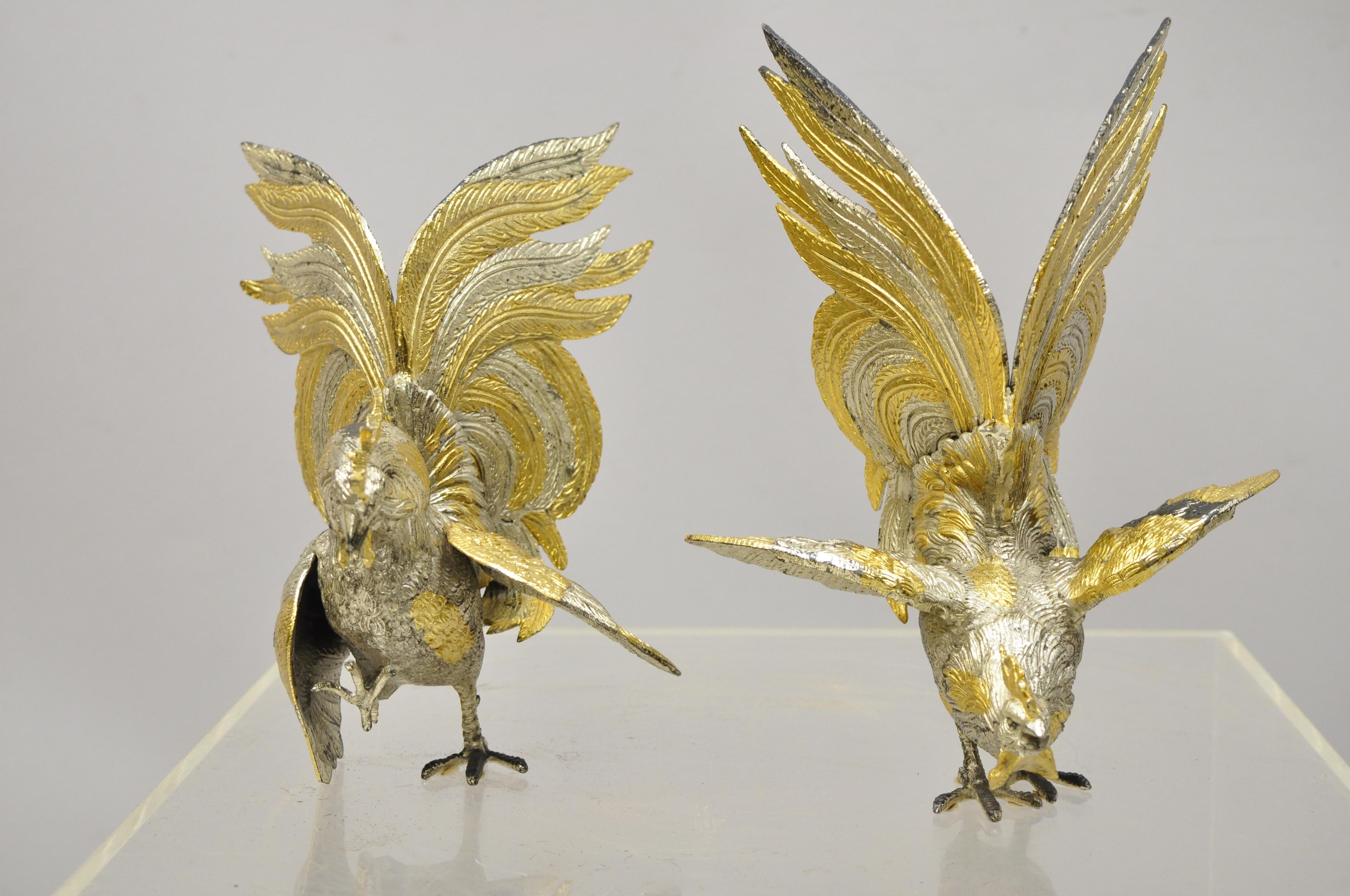 Vintage Italian gold and silver gilt metal cock fight fighting rooster figurines - a pair. Item features remarkable detail, silver and metallic gold gilt finish, original Italian stamp, quality heavy Italian craftsmanship, circa mid-20th century.