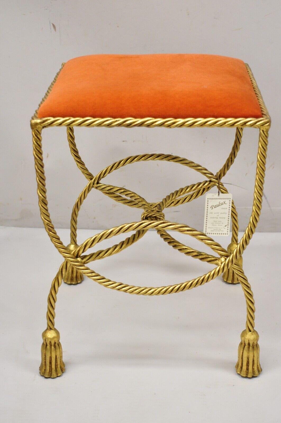 Vintage Italian Hollywood Regency Gold Gilt Iron Rope Tassel Vanity Bench Stool Seat. Item features gold gilt iron frame, rope and tassel scrolling design, orange upholstered seat, very nice vintage item, quality Italian craftsmanship, great style