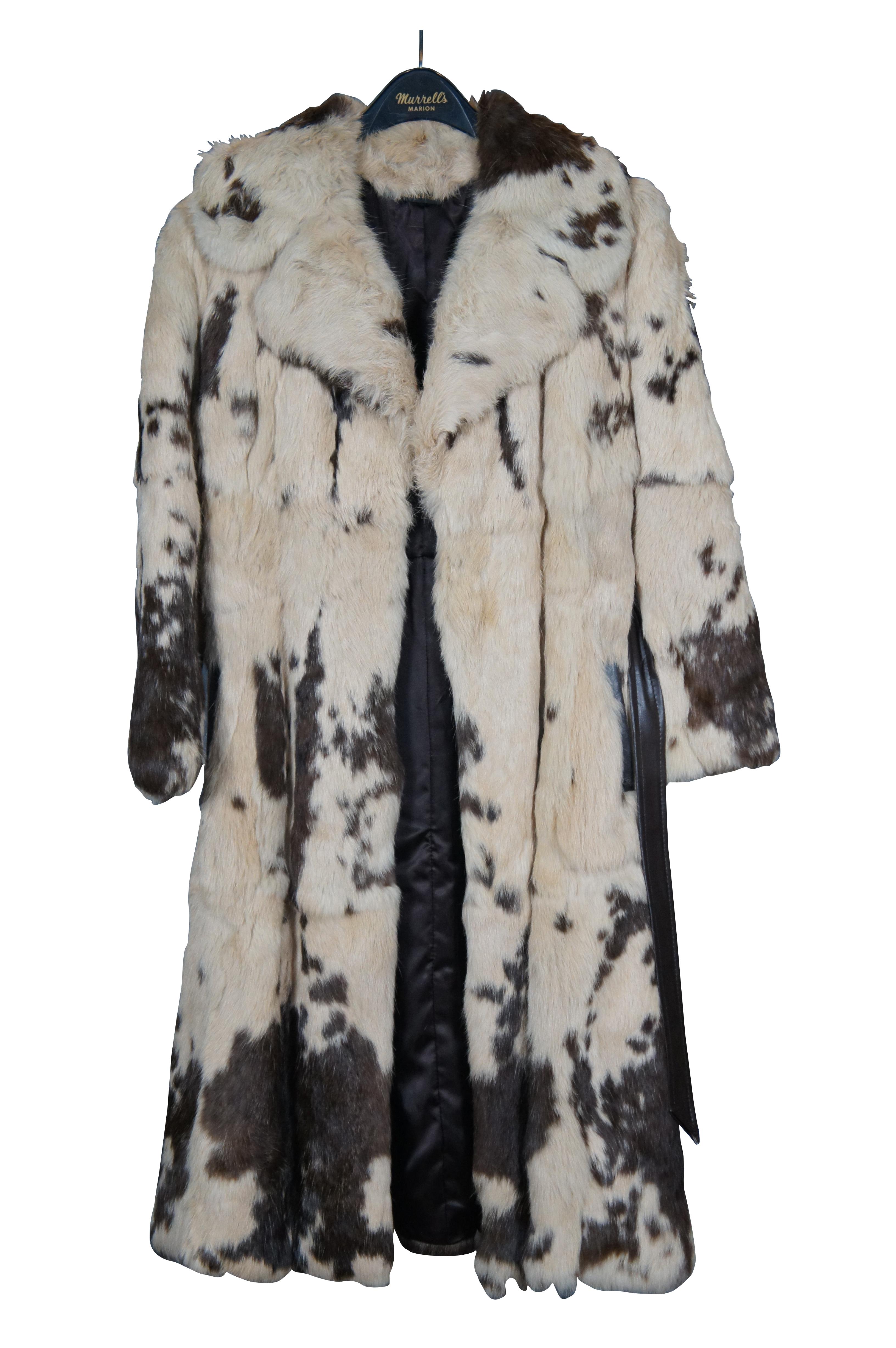 Vintage mid to late 20th century women's, full length, brown and white spotted cow hide fur coat, with leather belt and side pocket edges, and acetate satin lining. Made in Korea.

Shoulders - 19” / Arm Length - 22” / Chest – 38” / Back Length –