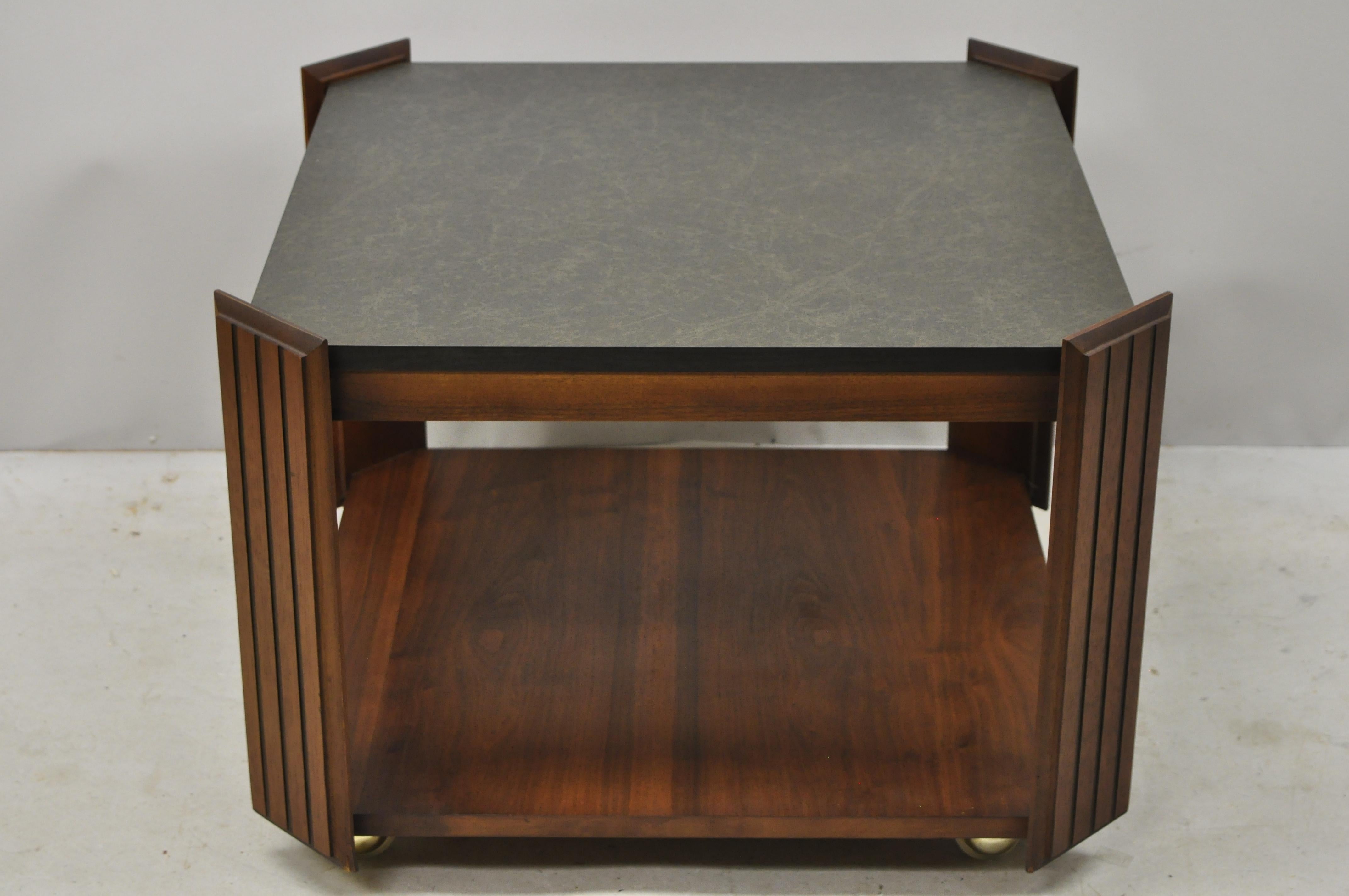 Vintage lane Altavista Mid-Century Modern walnut square rolling side coffee table. Item features rolling casters, laminate top, beautiful wood grain, nicely carved details, original stamp, clean modernist lines, quality American craftsmanship, circa