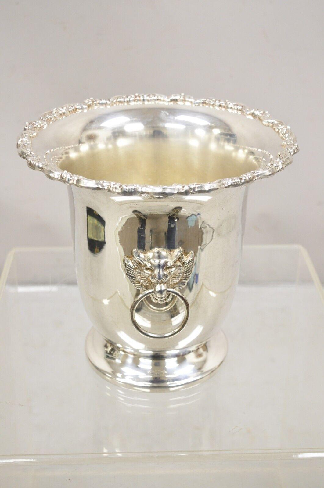 Vintage Leonard Regency Style Silver Plated Lion Head Fluted Champagne Ice Bucket. Circa 1960s. Measurements:  9.5