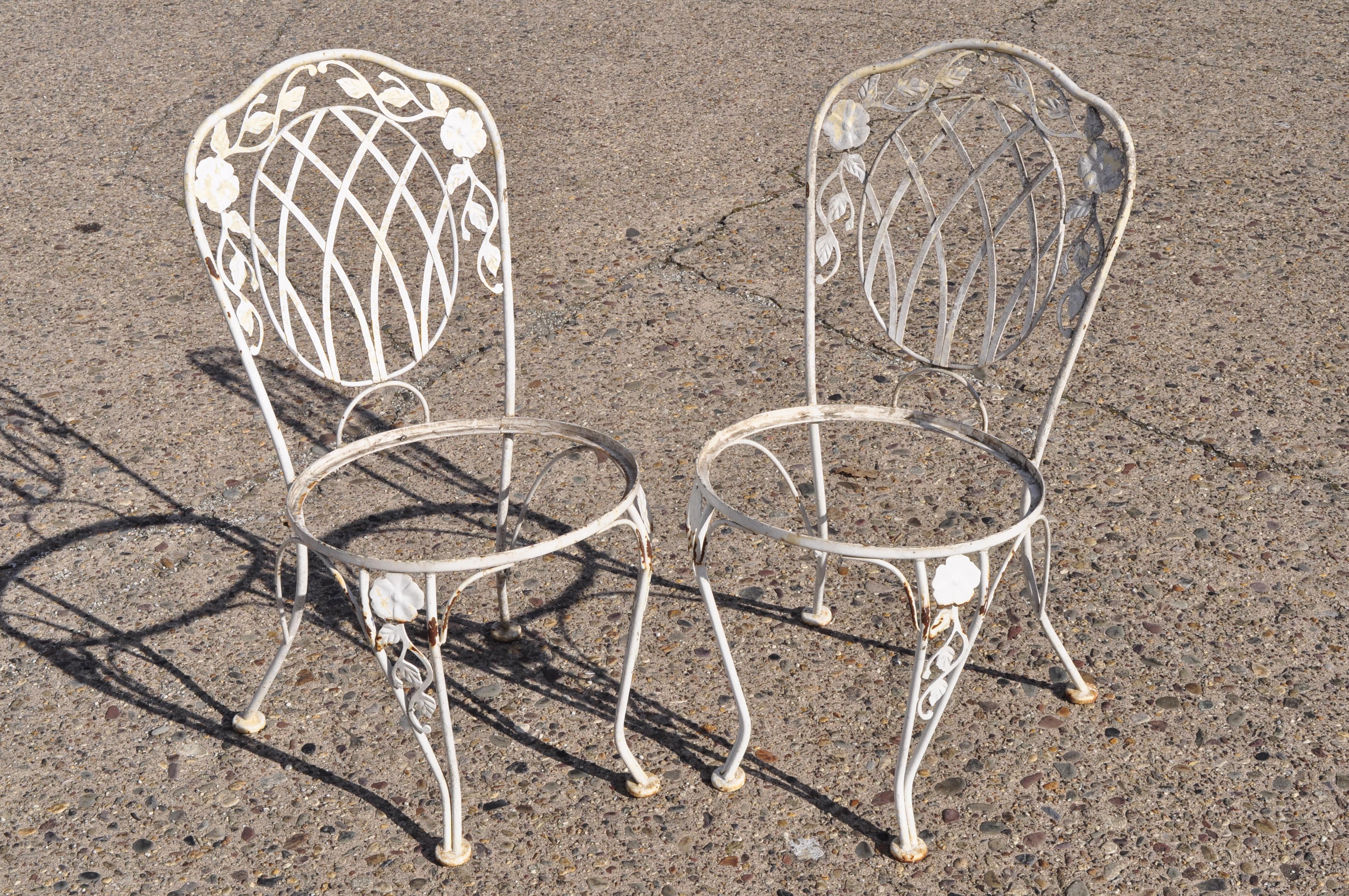 Vintage Lyon-Shaw Windflower Lattice Woodard style wrought iron garden dining set. Listing includes (4) dining side tables, small square glass top table with rounded corners, rippled glass, round seats, wrought iron construction, very nice vintage