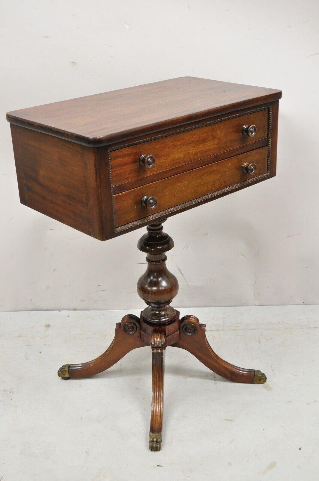 Vintage Mahogany Federal Style Pedestal Base 2 Drawer Duncan Phyfe Side End Table. Item features brass paw feet, pedestal base, beautiful wood grain, 2 drawers, very nice vintage item. Circa Early 20th Century. Measurements: 27