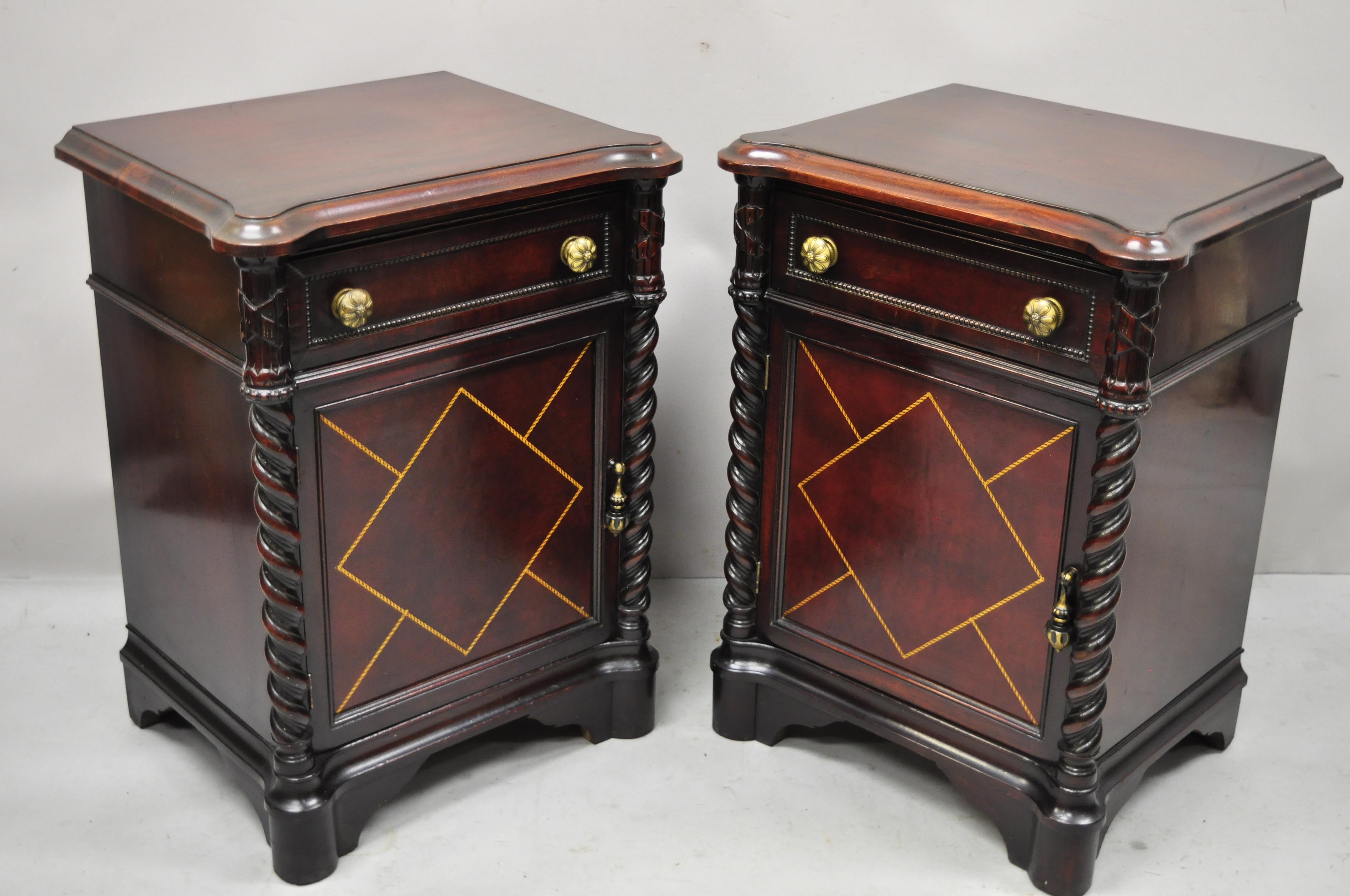 Vintage mahogany Hollywood Regency leather door nightstands bedside tables - a pair. Item features custom glass tops, leather door panel, spiral carved twist columns, beautiful wood grain, nicely carved details, 1 dovetailed drawer, solid brass