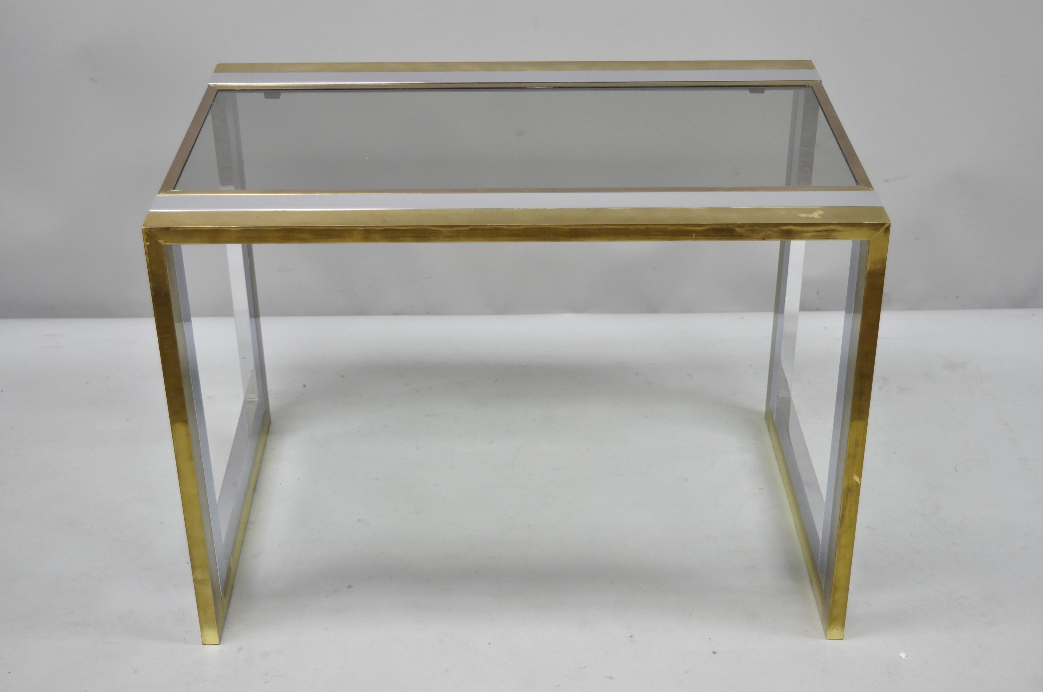 Vintage Mid-Century Modern chrome brass glass waterfall side table by Messin Finland. Chrome and brass waterfall frame, glass top, original label, clean modernist lines, sleek sculptural form, circa 1970. Measurements: 21