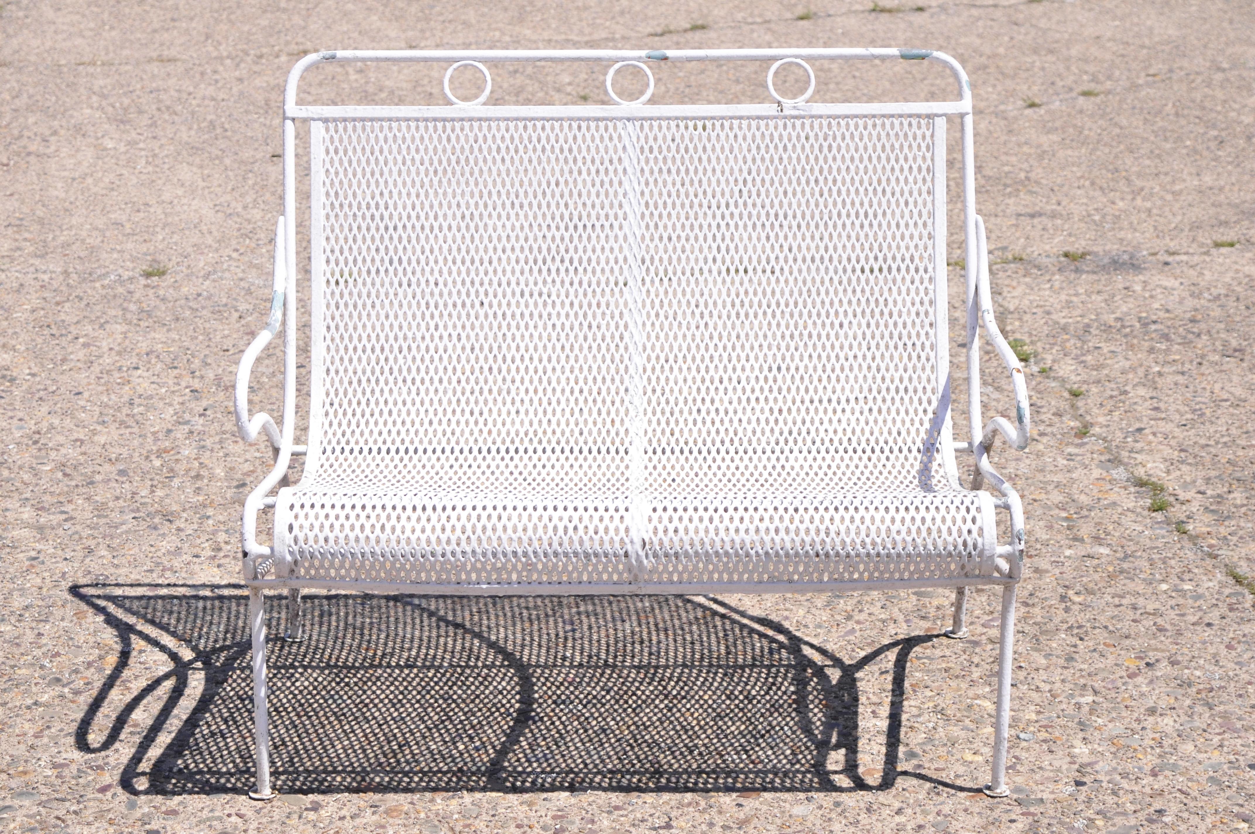 Vintage Russell Woodard Sculptura wrought iron mesh Mid Century garden patio bench. Item features heavy gauge wrought iron construction, very rare model, quality American craftsmanship, sleek sculptural form, Circa Mid 20th century. Measurements: