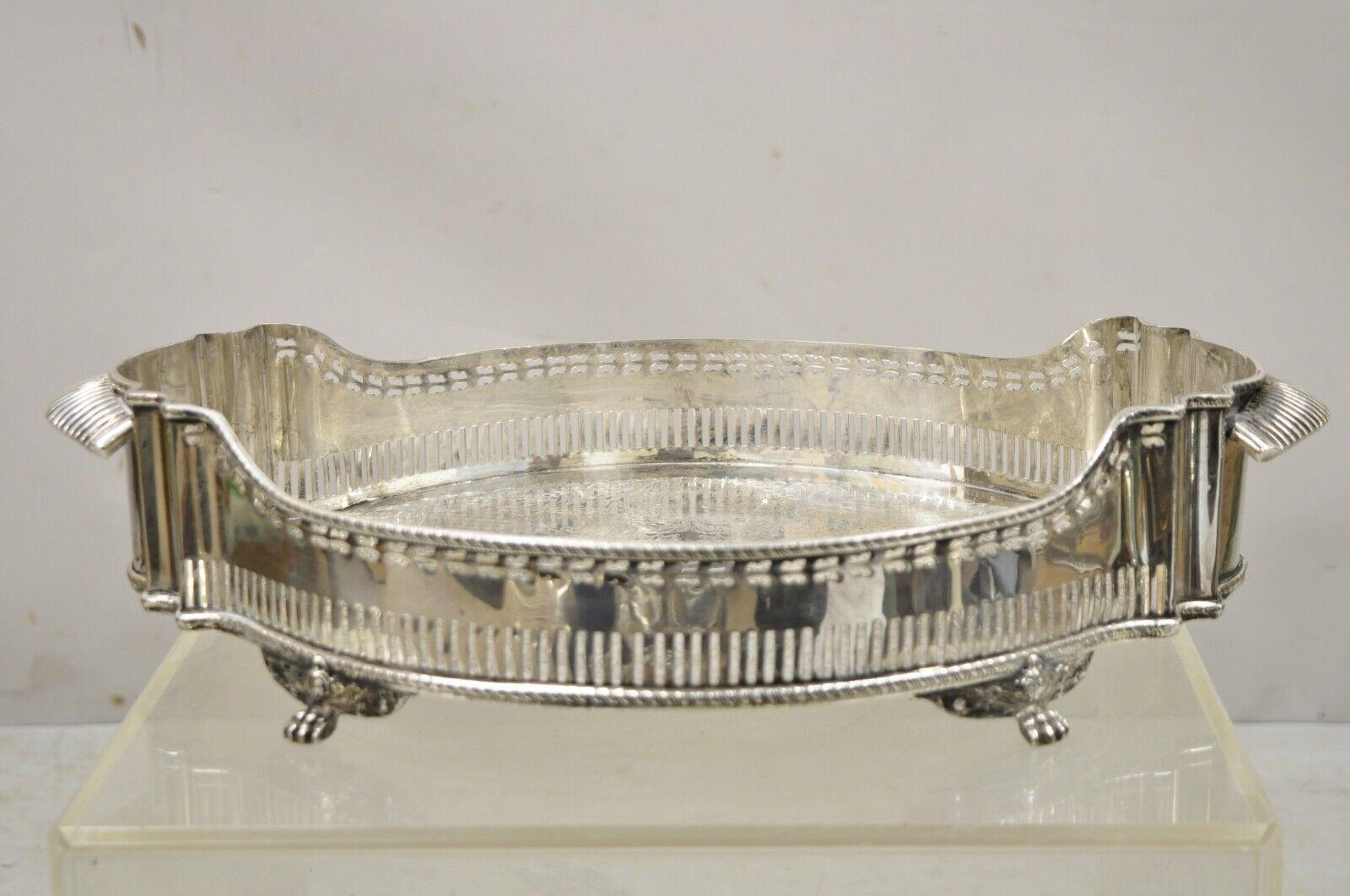 Vintage Silver Plated Shapely Serving Platter Tray with Pierced Gallery on Paw Feet. Item features a nice deep form, attractive shapely design, pierced gallery, etched scrollwork design to center, raised on paw feet, unmarked, very nice vintage