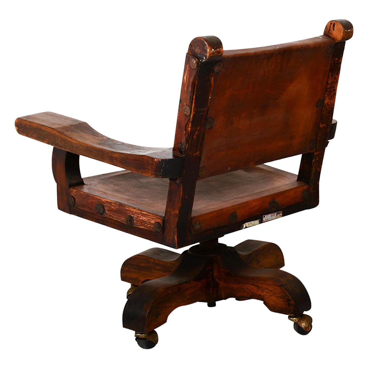 Office Chair
Vintage Mexican Mahogany and Leather OFFICE CHAIR Spanish Colonial Revival office chair saddle leather with original nails. Comfortable armrest. Height is adjustable. Vintage Mid Century Mexican Mahogany office chair on casters.