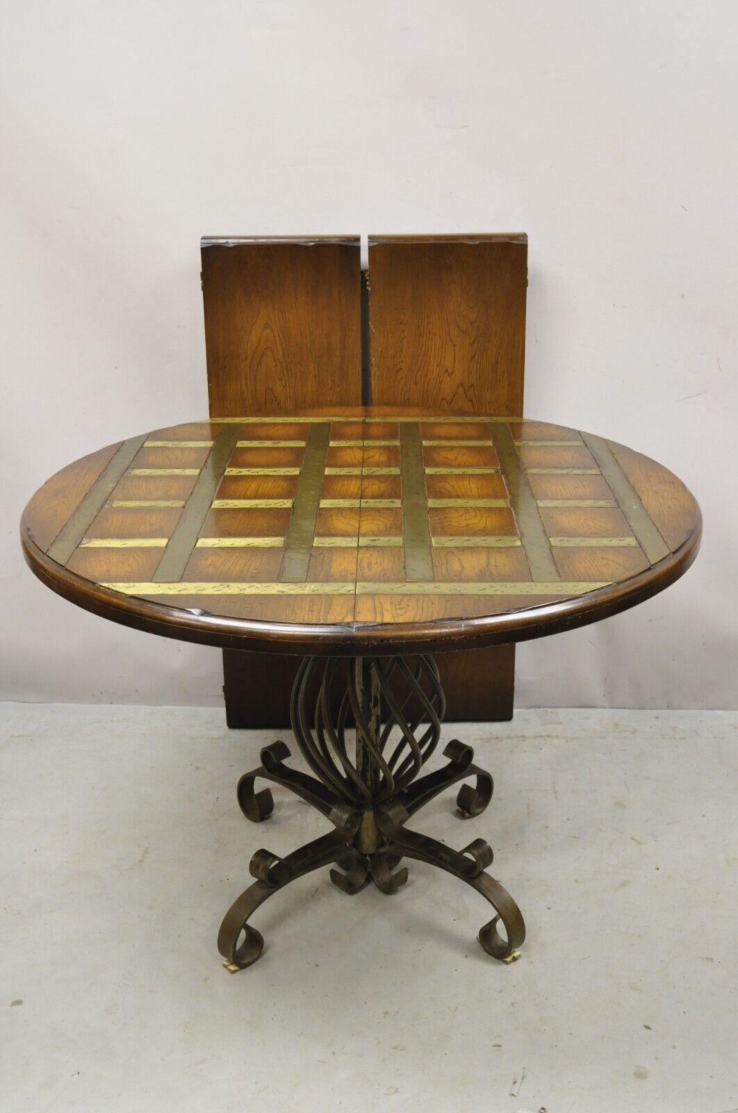 Vintage Spanish rustic twisted iron pedestal metal lattice inlay round dining table 2 leaves. Item features (2) 12