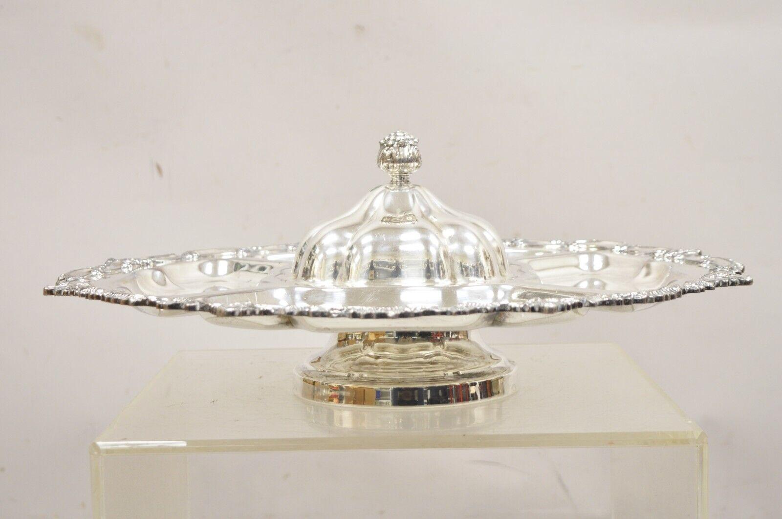 Vintage Victorian Style Silver Plated English Revolving Vegetable Serving Platter. Item features a spinning/revolving lazy Susan pedestal base, removable center lid, original hallmark, very nice vintage item. Circa Mid 20th Century. Measurements: 
