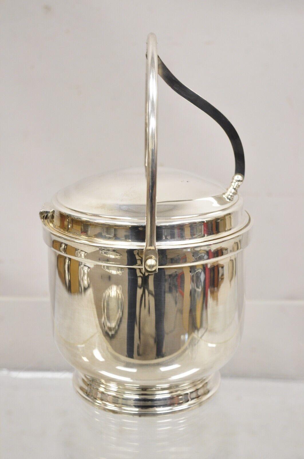 Vintage Wallace Mid Century Modern Silver Plated Hinged Lid Ice Bucket w glass liner. Circa Mid 20th Century.
Measurements: 12.5