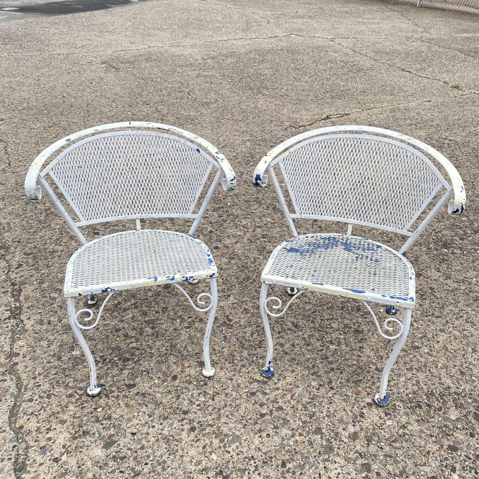 Vintage Wrought Iron Woodard Salterini Style Mid Century Outdoor Patio Chairs - Pair. Circa Mid to Late 20th Century.
Measurements: 28.5