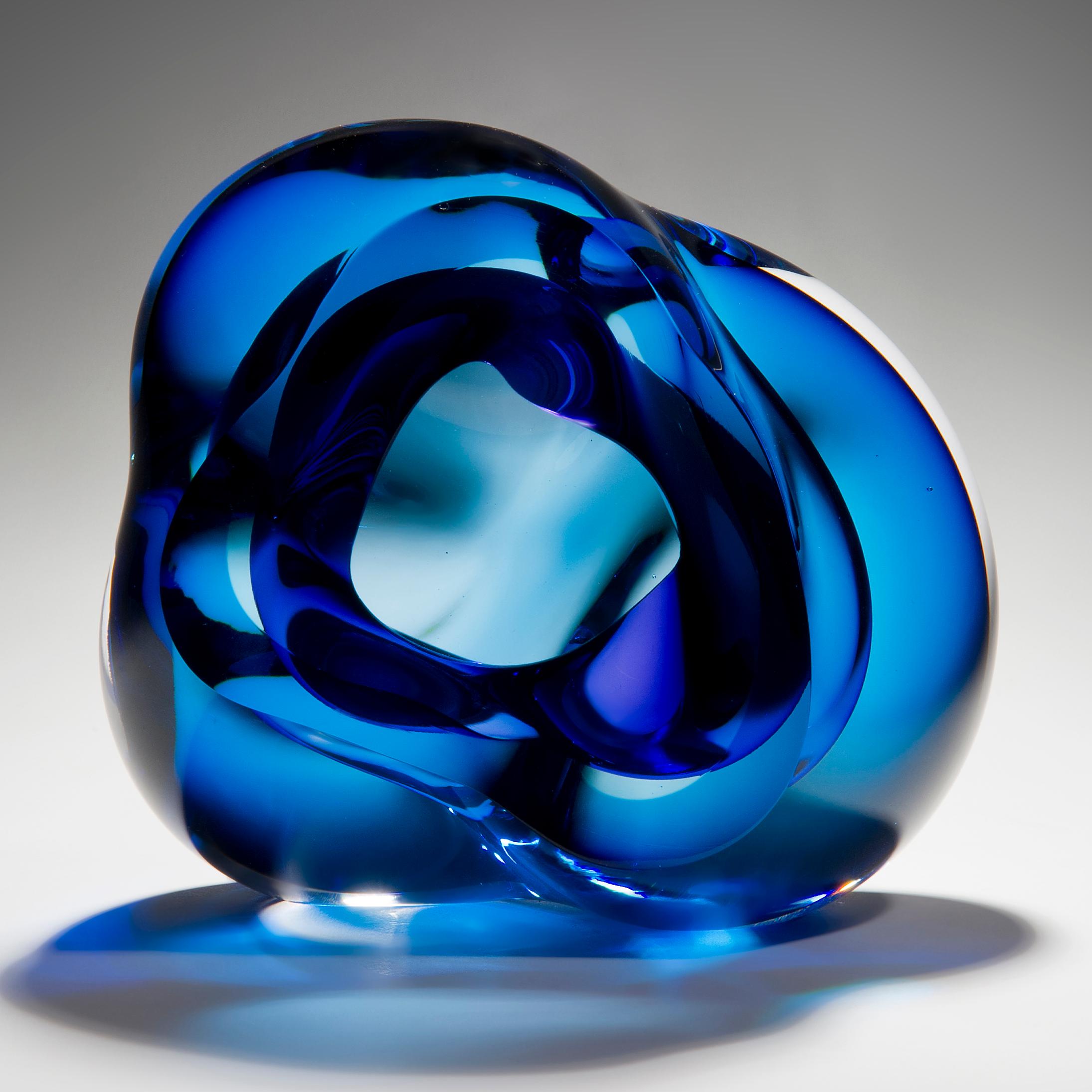 Vug in Blue and Hyacinth is a unique handblown sculpture by the British artist Samantha Donaldson. Created by layers of coloured glass in blue and hyacinth, the transparent colours merge and create further hues throughout the piece. An additional