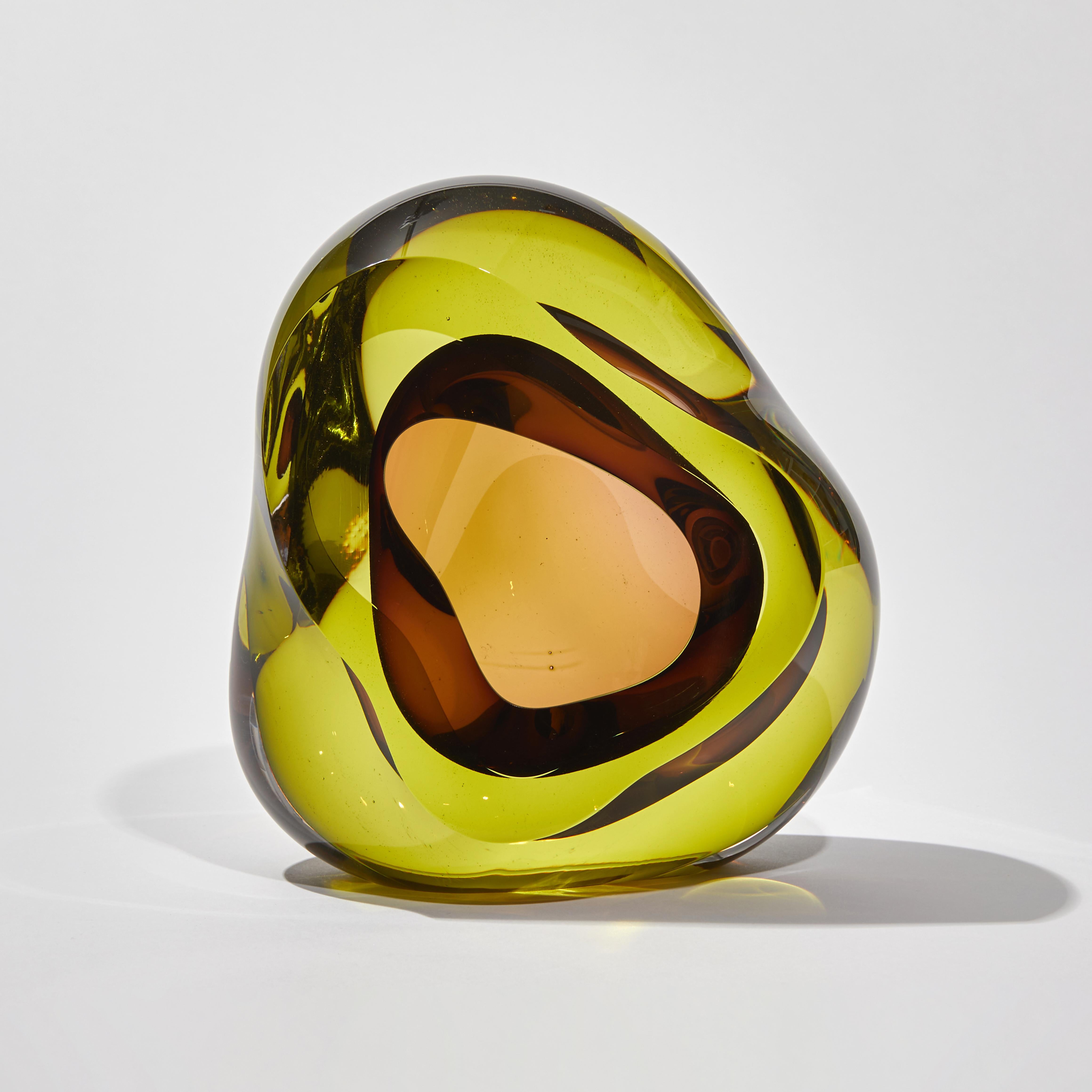 Vug in Lime & Purple is a unique hand blown sculpture by the British artist Samantha Donaldson. Created by layers of colored glass in bright lime and purple, the transparent colors merge and create further hues throughout the piece. An additional