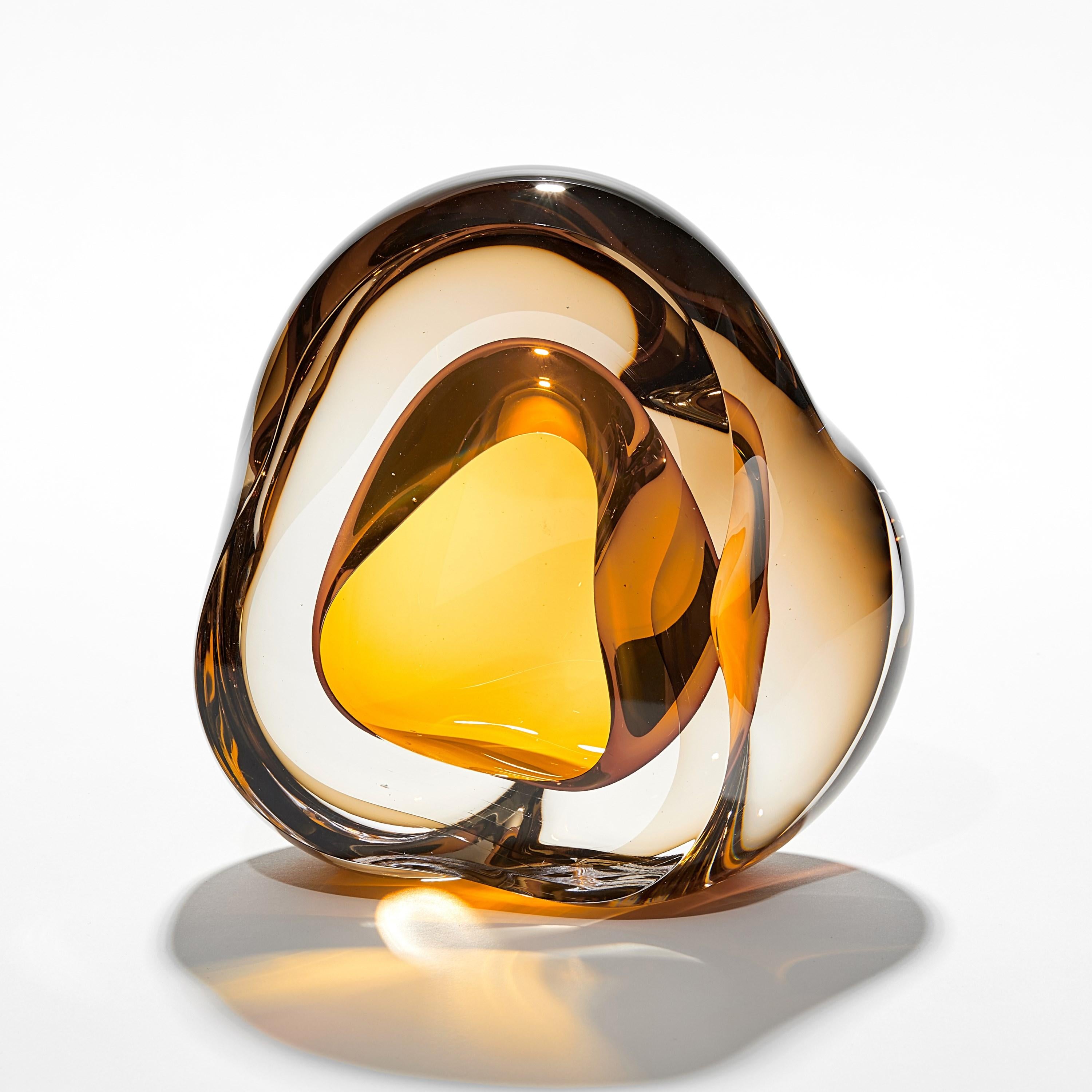 'Vug in Olivin & Gold Topas' is a unique hand blown sculpture by the British artist, Samantha Donaldson.

Created by layers of coloured glass, the transparent colours merge and create further hues throughout the piece. An additional optical