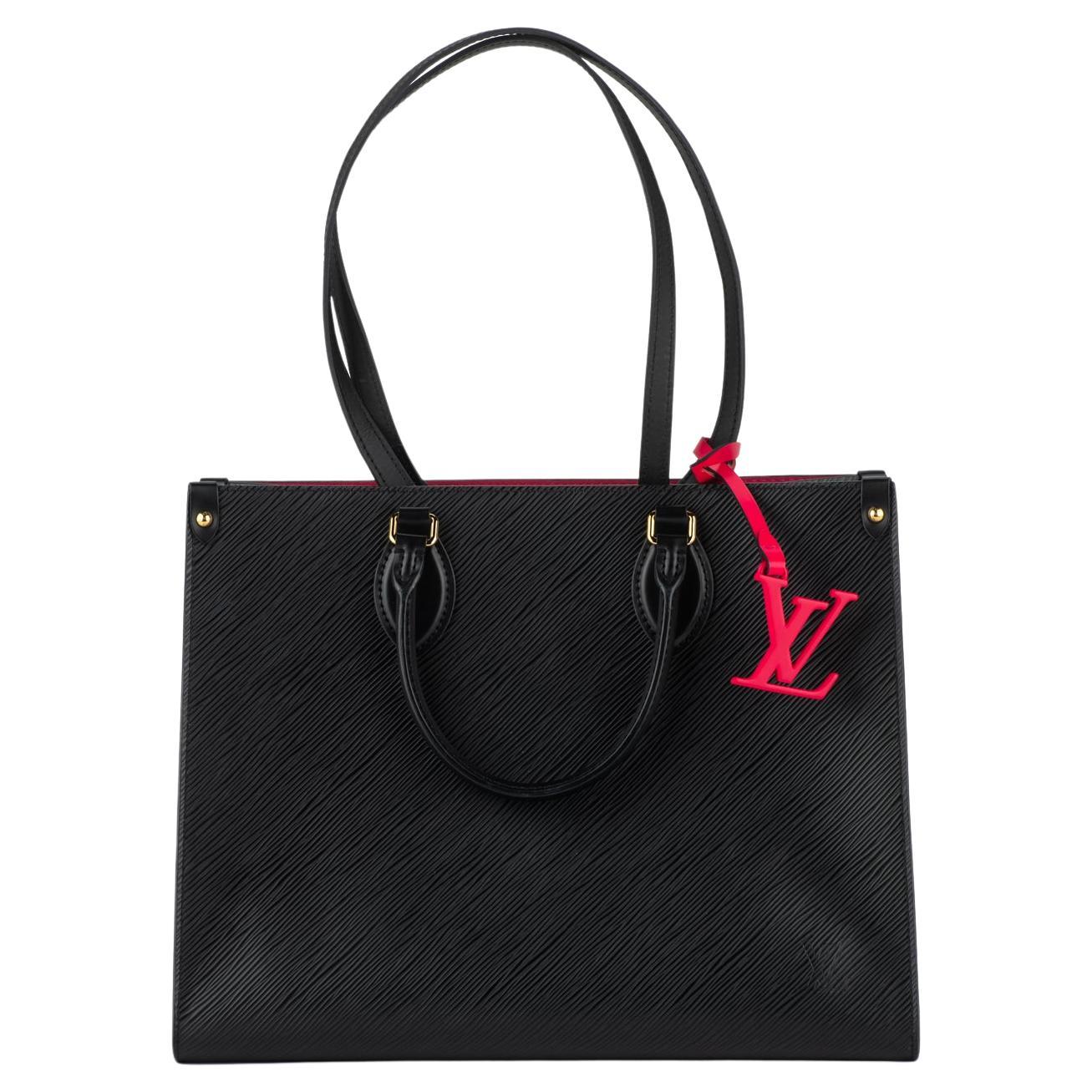 Vuitton Epi On The Go MM noir/fuchsia en vente