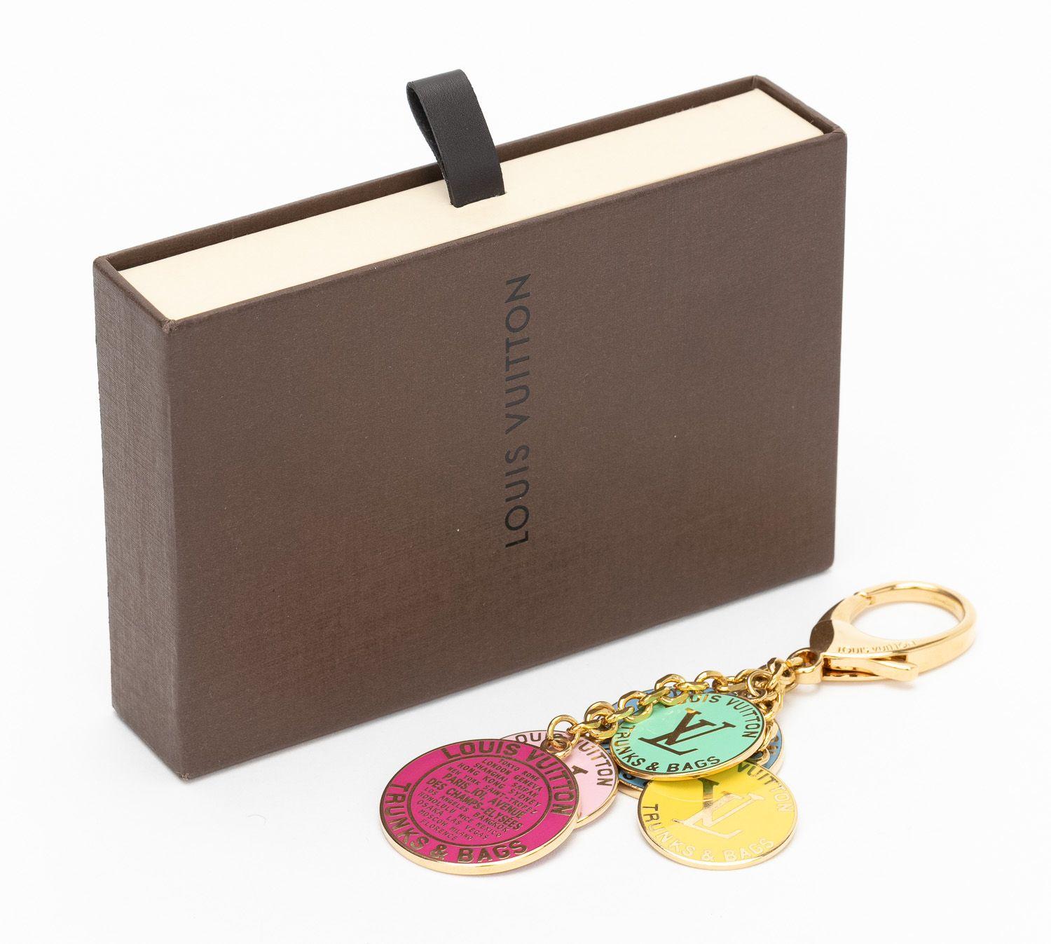 Louis Vuitton bag charm /keychain with enamel pastel coins. Come with original dust cover and box.