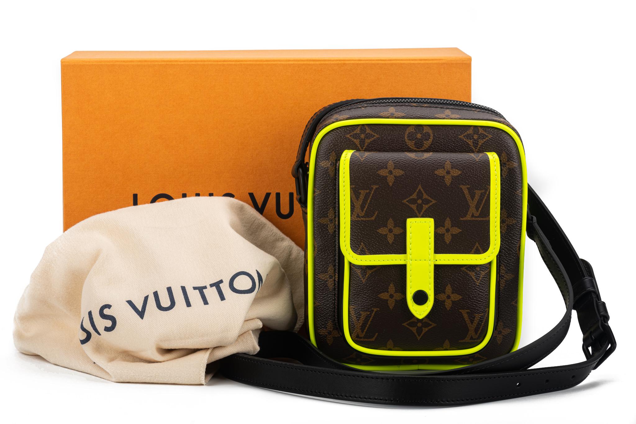 Louis Vuitton limited edition Maccassar Christopher cross body bag. Classic brown monogram coated canvas with fluorescent yellow and black trim. The shoulder strap measures 20” and it is adjustable. Inside there is a compartment for credit cards.