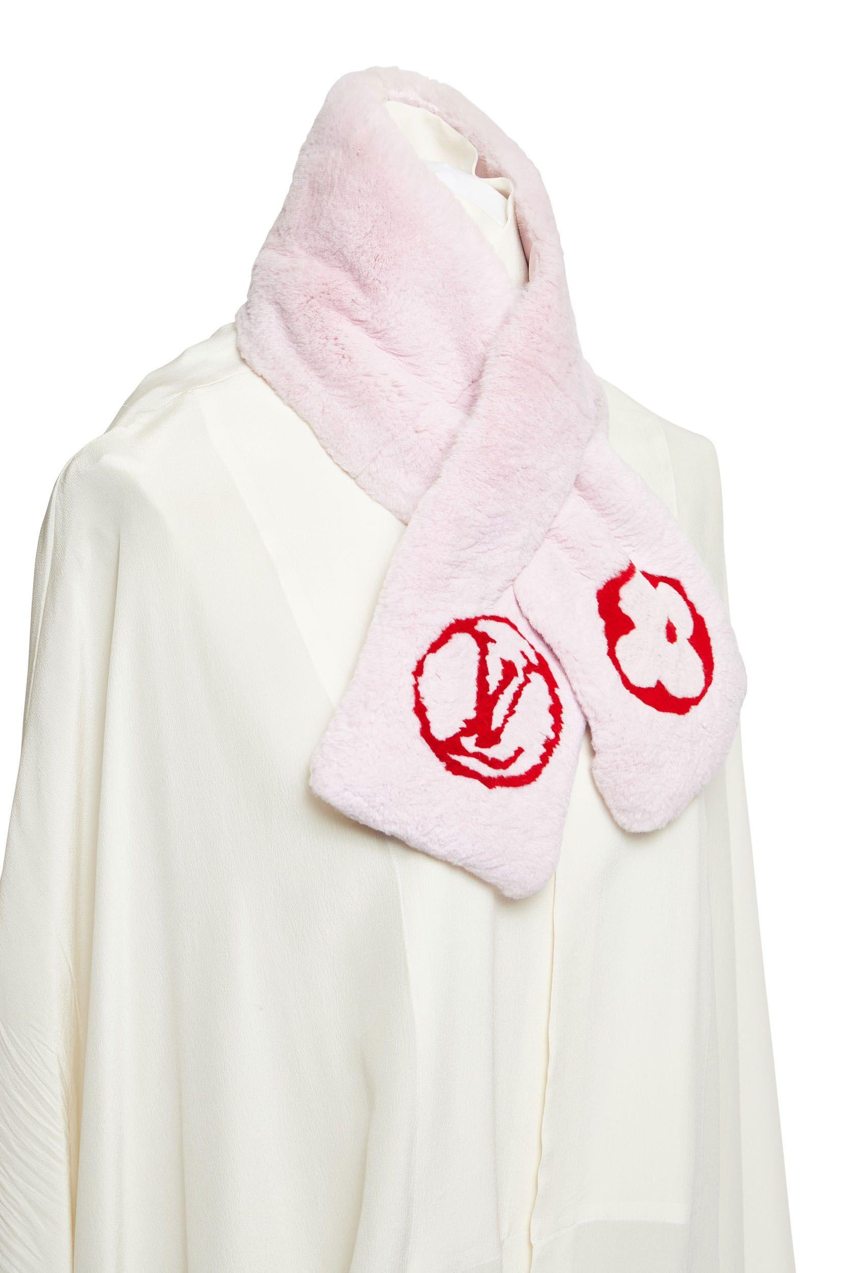 Louis Vuitton pink rabbit scarf with red logo. Characteristic Vuitton interlaced closure. Super soft neck warmer.