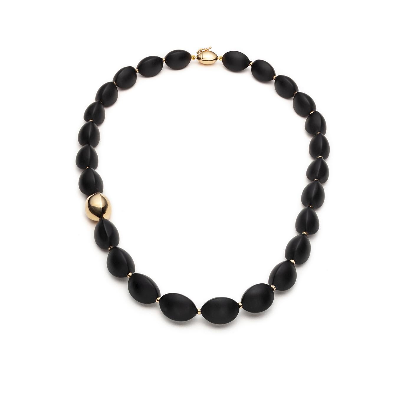 This unique, volcanic rock necklace adapts perfectly to the shape of your neck. The beads are strung on silk and knotted for extra security. The knots are hidden by tiny 18K gold inserts. The 18k yellow gold bead and the custom-made clasp, replicate