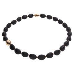 Vulcanica, Volcanic Rock Necklace Mounted with 18k Yellow Gold