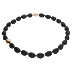 Vulcanica, Volcanic Rock Necklace Mounted with 18k Yellow Gold