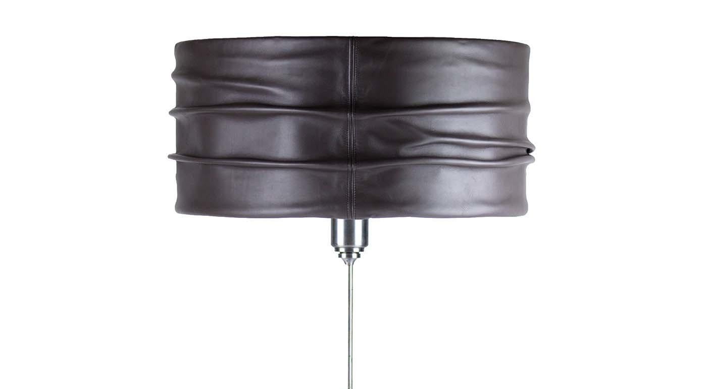 Bringing light while also adding style to any room, this sophisticated table lamp is an ideal accent for any end table or console in need of a chic focal point. Taking on a traditional midcentury silhouette, it features a steel structure and round