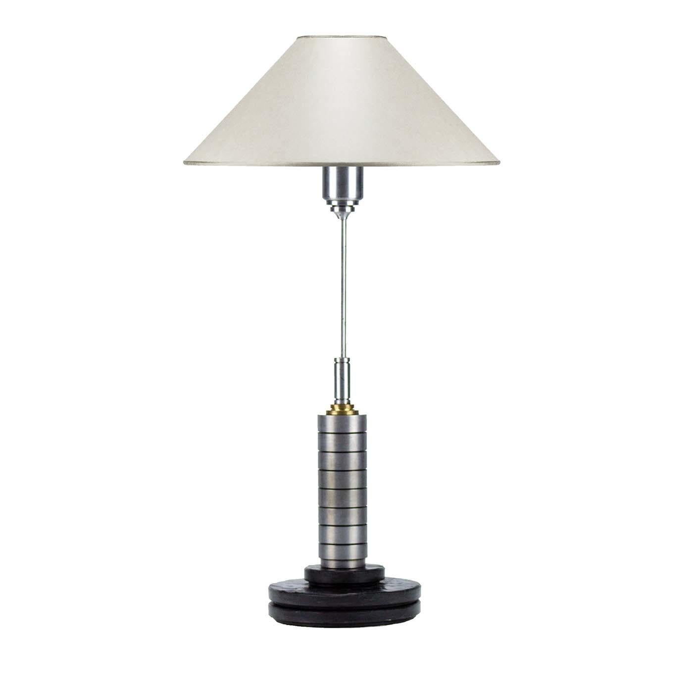 Sporting a slender structure handcrafted of steel, the stem of this superb abat-jour has a cylindrical element with a brass-colored accent on top and a striking lampshade holder with concentric rings that support the white pagoda parchment shade.