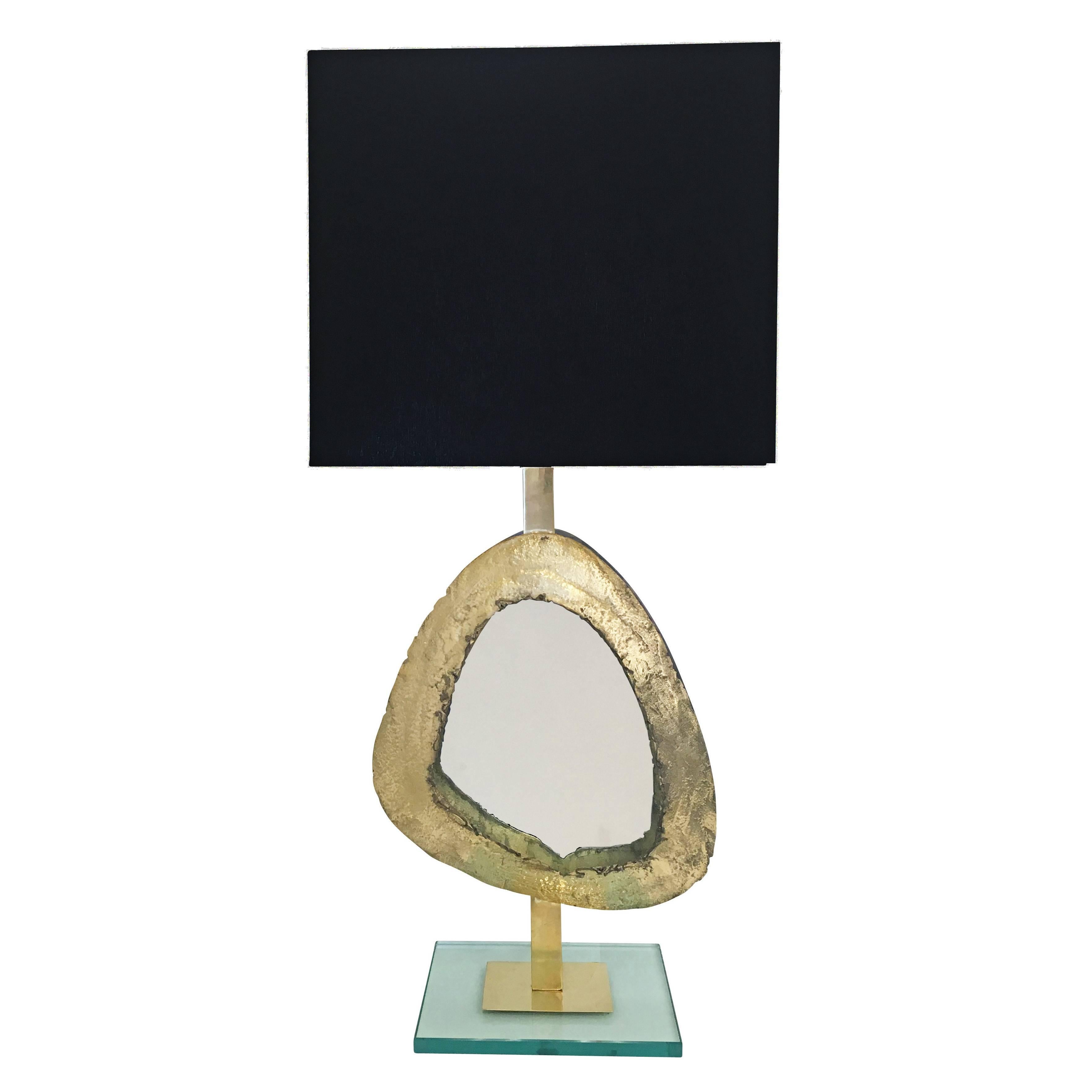 Large brass and glass table lamp designed by Italian artisan Daniele Bottacin for Gaspare Asaro’s studio collection, form A. Each handmade piece features a Brutalist frame which contrast beautifully with the clean lines of the mirrored centre and