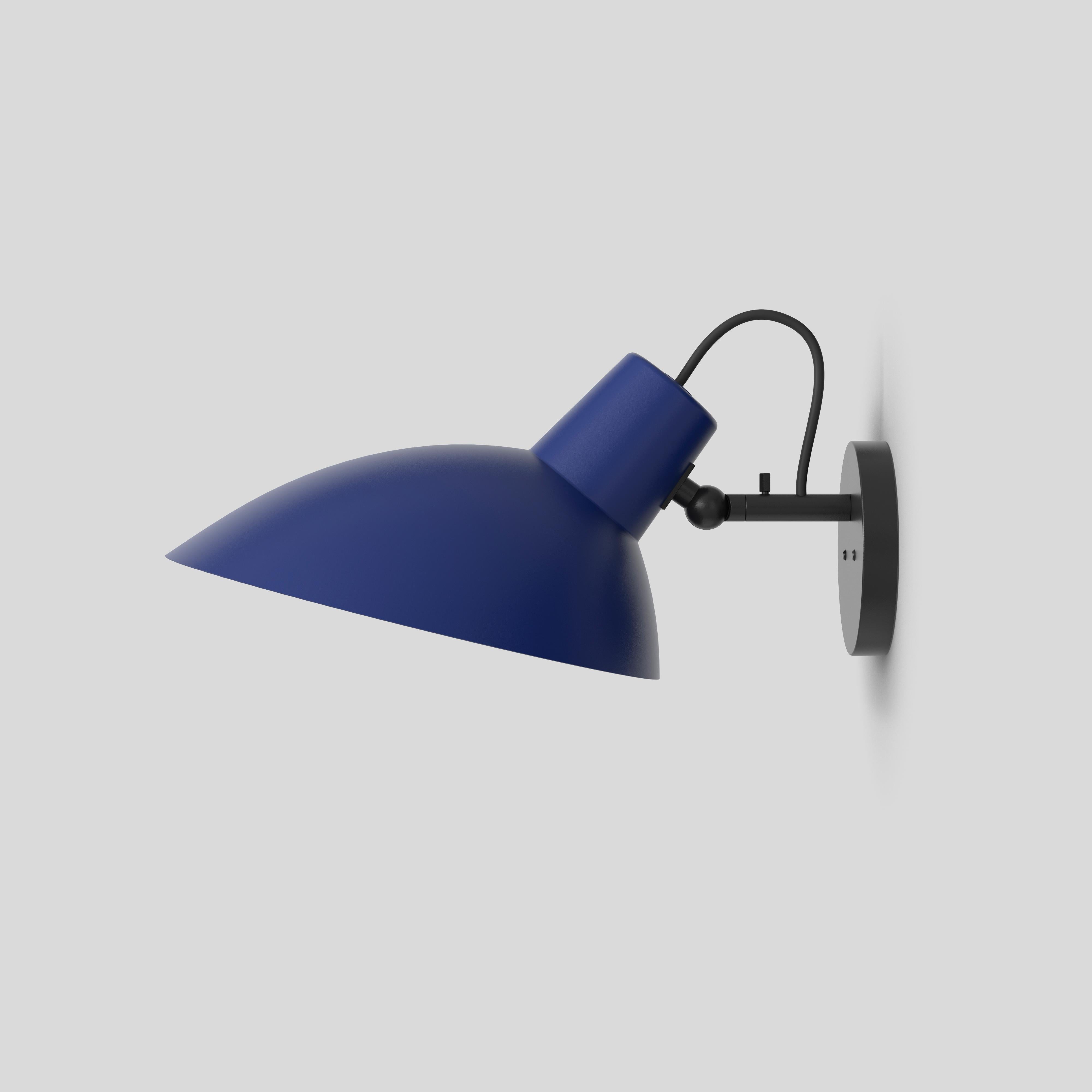 VV Cinquanta wall lamp
Design by Vittoriano Viganò
This version is with blue lacquered reflector and black mount.

The VV Cinquanta features an elegant and versatile posable direct light source that can swivel and tilt. The wall model is mounted on