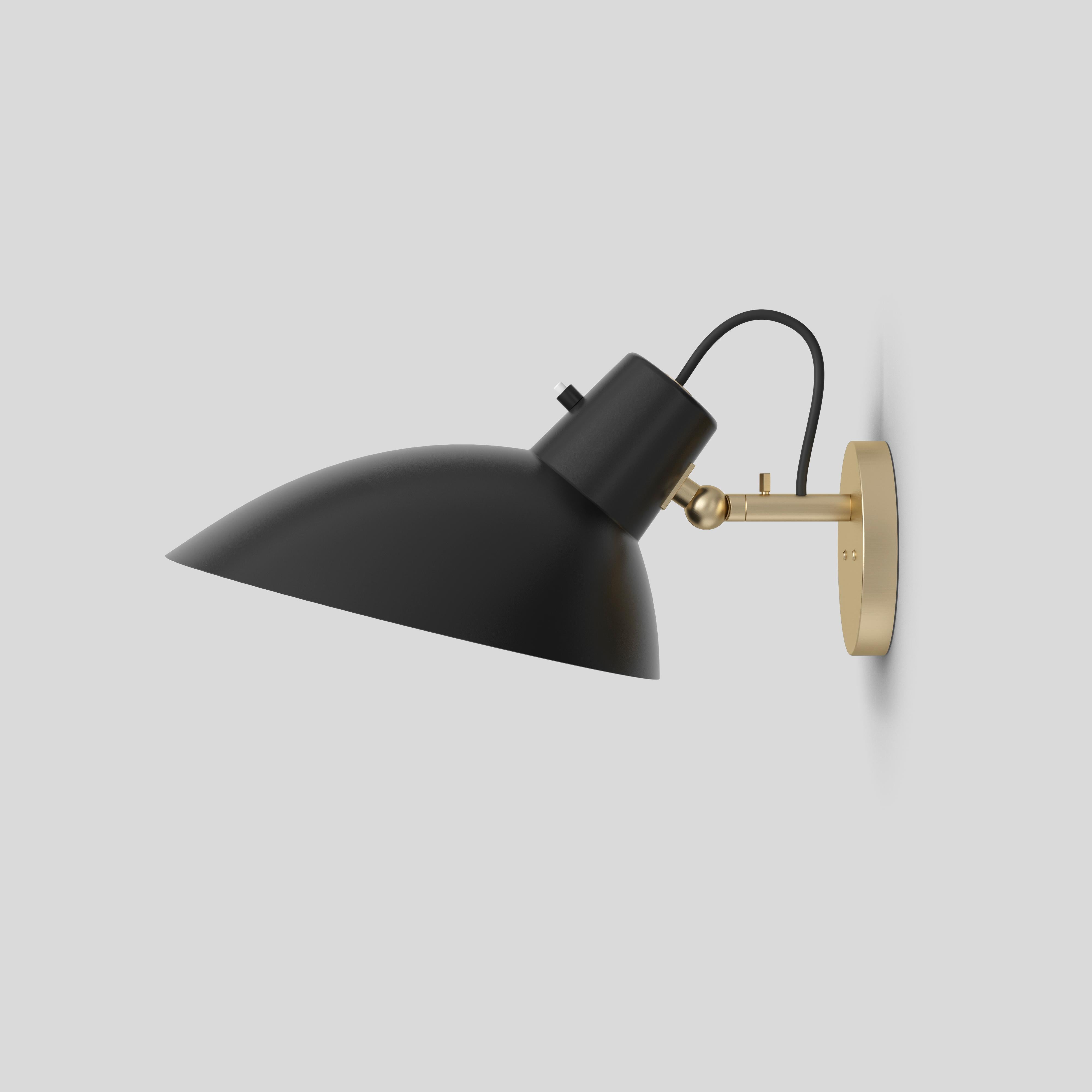 VV Cinquanta Wall
Design by Vittoriano Viganò
This version is with black lacquered reflector and brass mount, including switch

The VV Cinquanta features an elegant and versatile posable direct light source that can swivel and tilt. The Wall