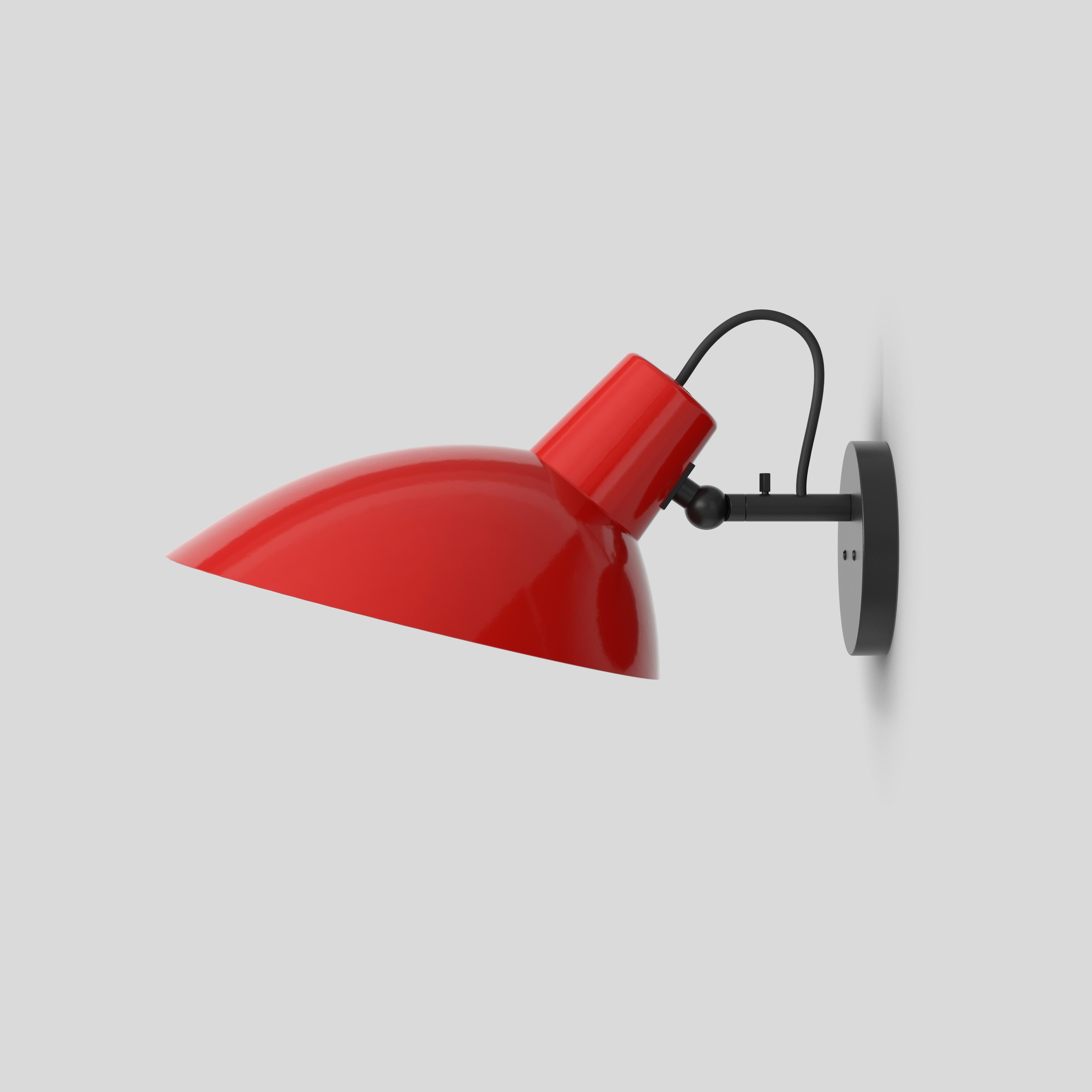 VV Cinquanta Wall Lamp
Design by Vittoriano Viganò
This version is with Red Lacquered Reflector and Black Mount.

The VV Cinquanta features an elegant and versatile posable direct light source that can swivel and tilt. The Wall model is mounted