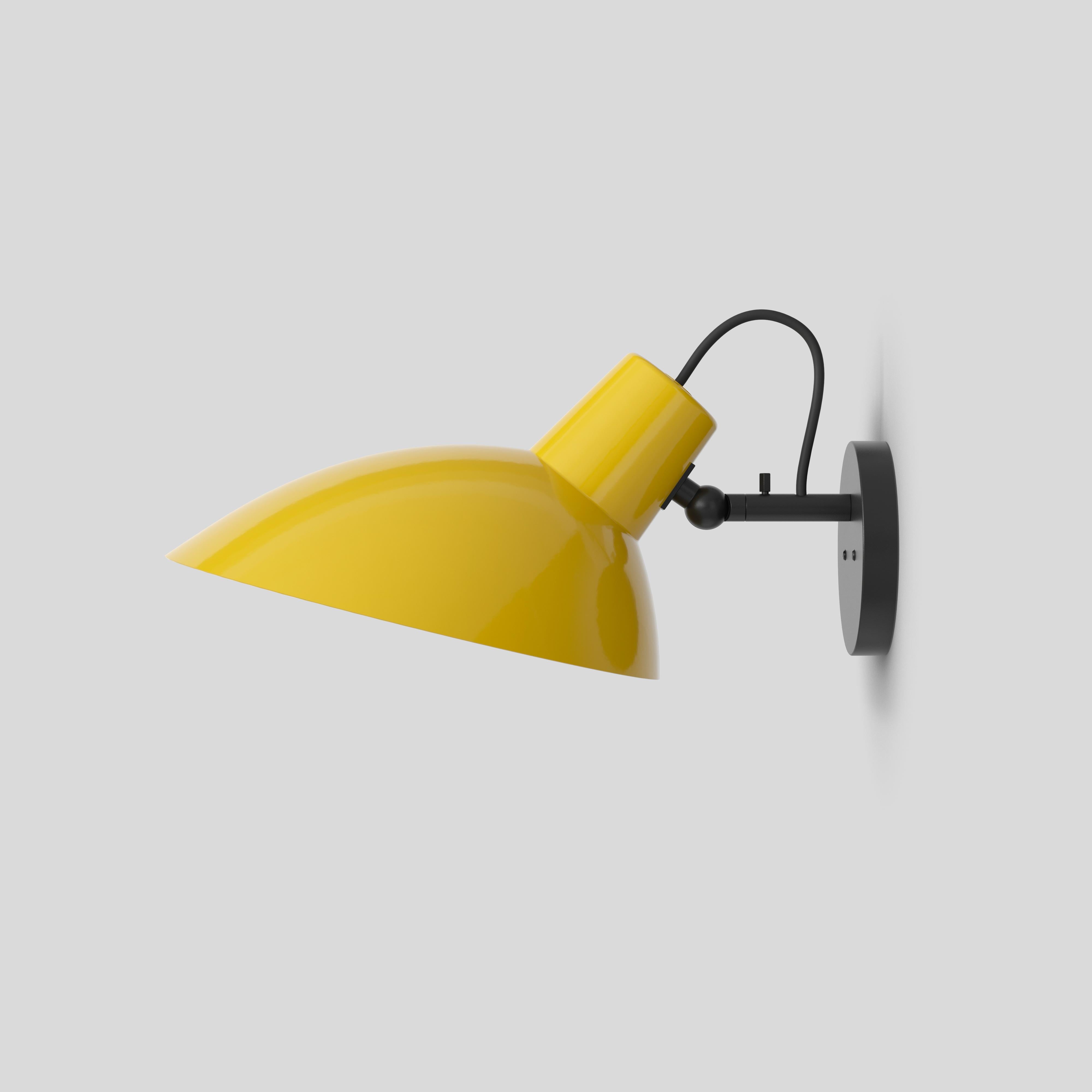 VV Cinquanta wall lamp
Design by Vittoriano Viganò
This version is with yellow lacquered reflector and black mount.

The VV Cinquanta features an elegant and versatile posable direct light source that can swivel and tilt. The wall model is