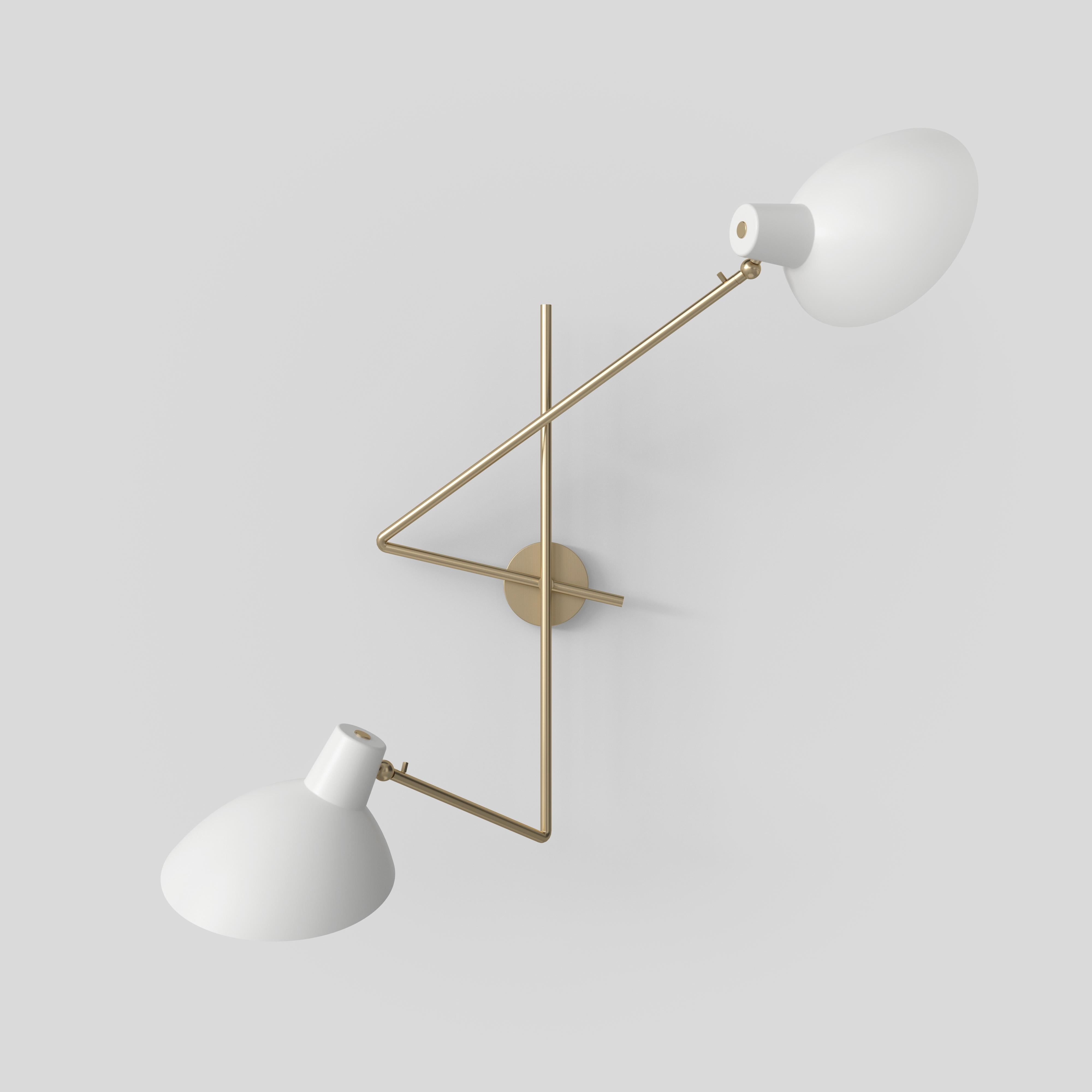 VV Cinquanta twin wall lamp.
Design by Vittoriano Viganò.
This version is with black lacquered reflector and black mount.

The VV Cinquanta features an elegant and versatile posable direct light source that can swivel and tilt. The Twin model is an
