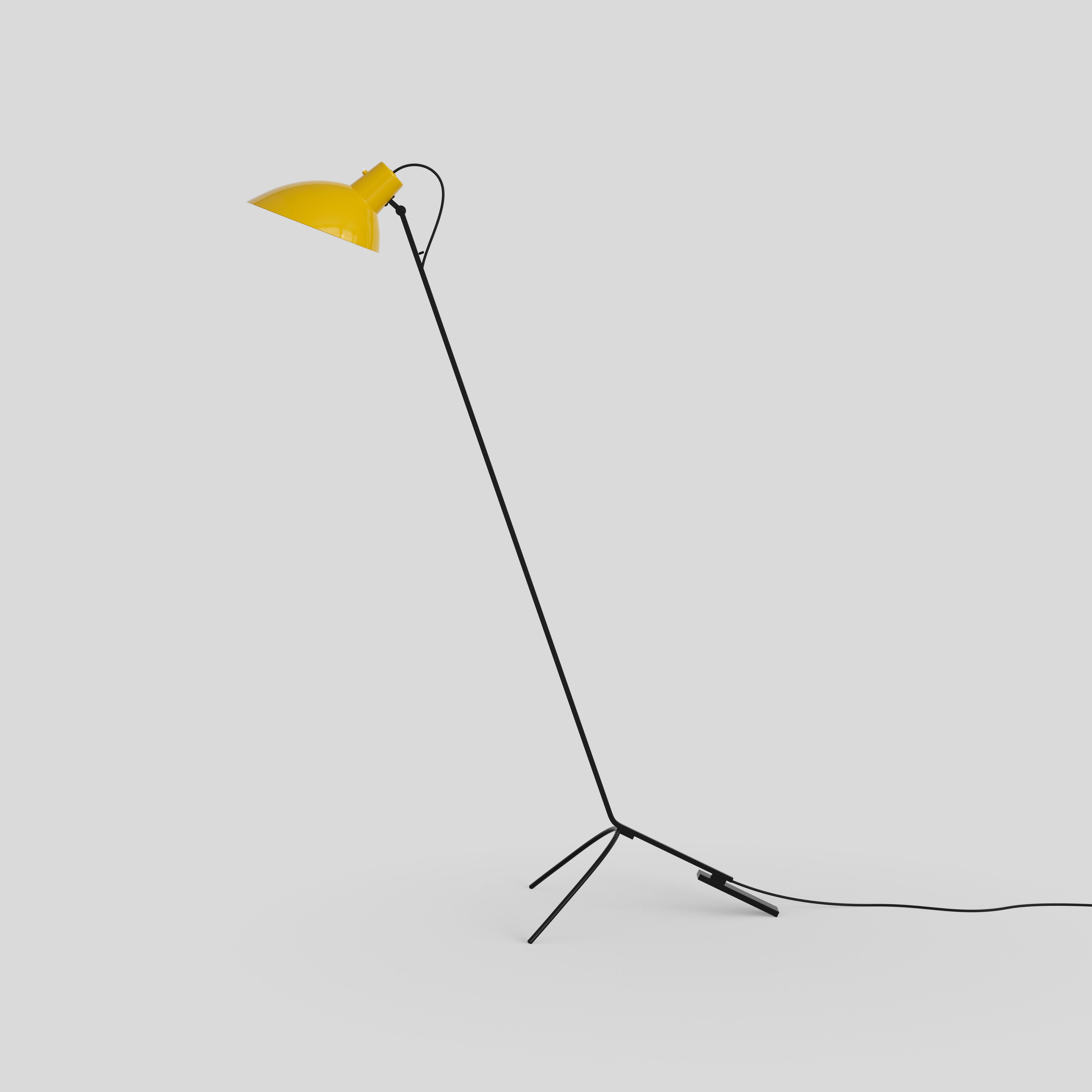 VV Cinquanta floor lamp.
Design by Vittoriano Viganò.
This version is with yellow lacquered reflector and black frame.

The VV Cinquanta features an elegant and versatile posable direct light source that can swivel and tilt, from direct working