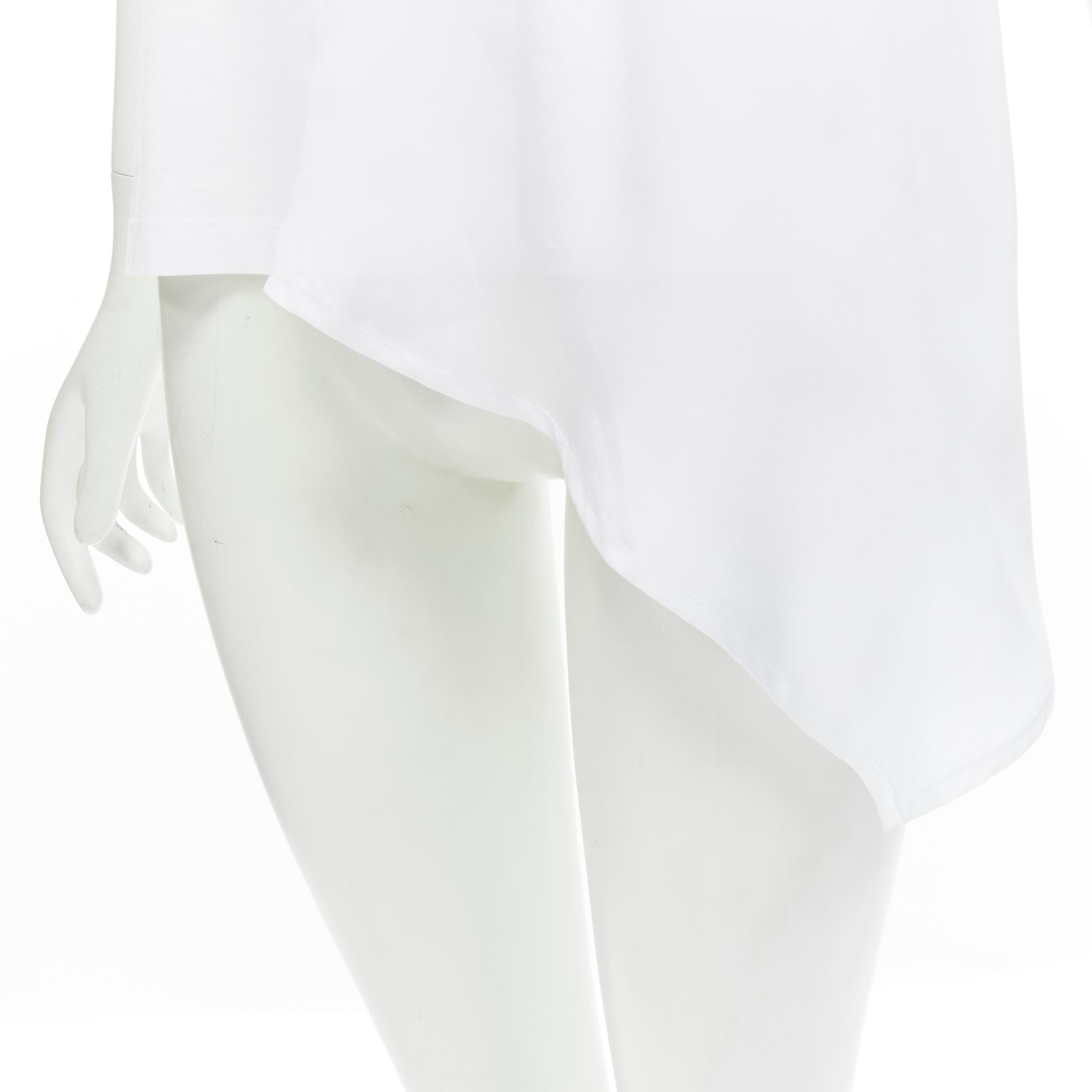 VVB VICTORIA BECKHAM 100% cotton polyester insert asymmetric t-shirt S 
Reference: CECU/A00014 
Brand: Victoria Victoria Beckham 
Material: Cotton 
Color: White 
Pattern: Solid 
Extra Detail: Crew Neck. Pleat shoulder. Insert polyester panel. 
Made