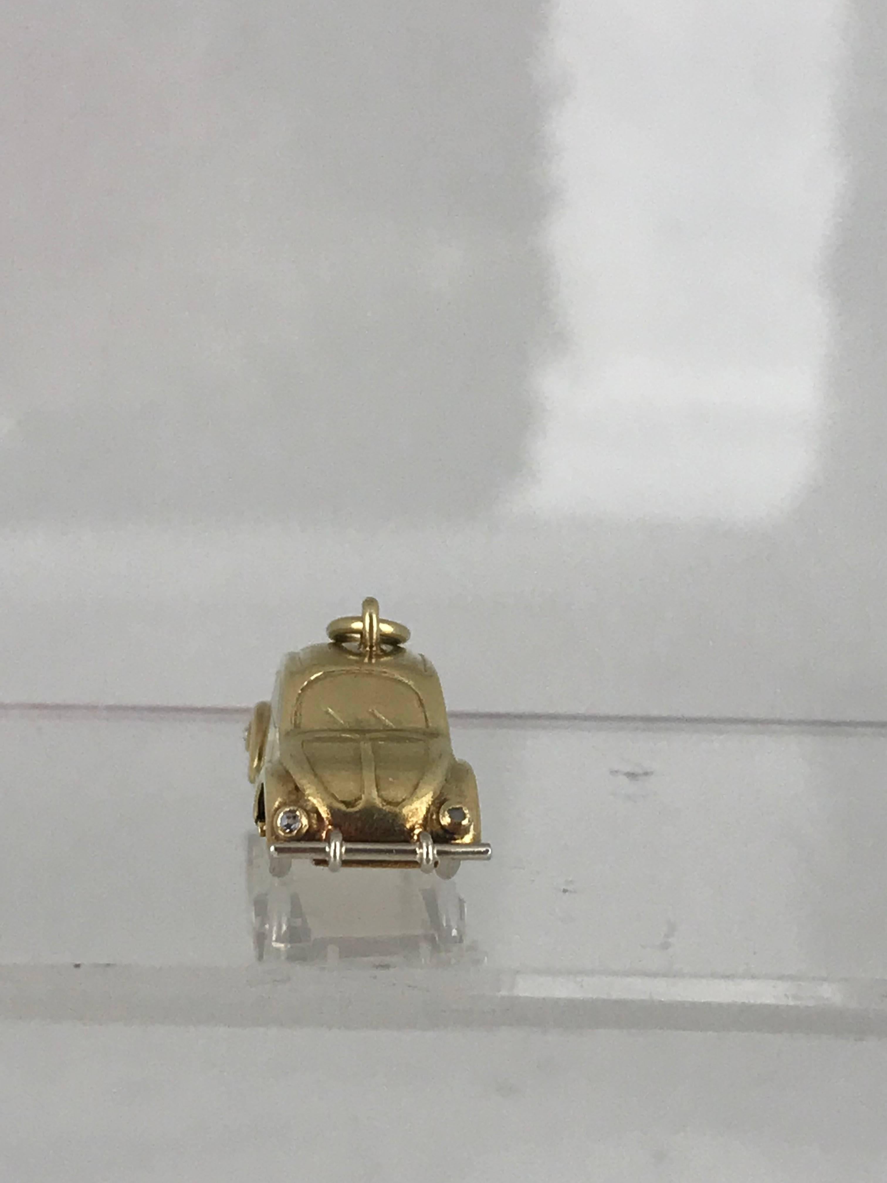 Collectable, VW Beetle car with handmade features in white and yellow gold. 
Circa 1950
Wheels move and the detail is impressive on this treasure.

GIA Gemologist inspected & evaluated