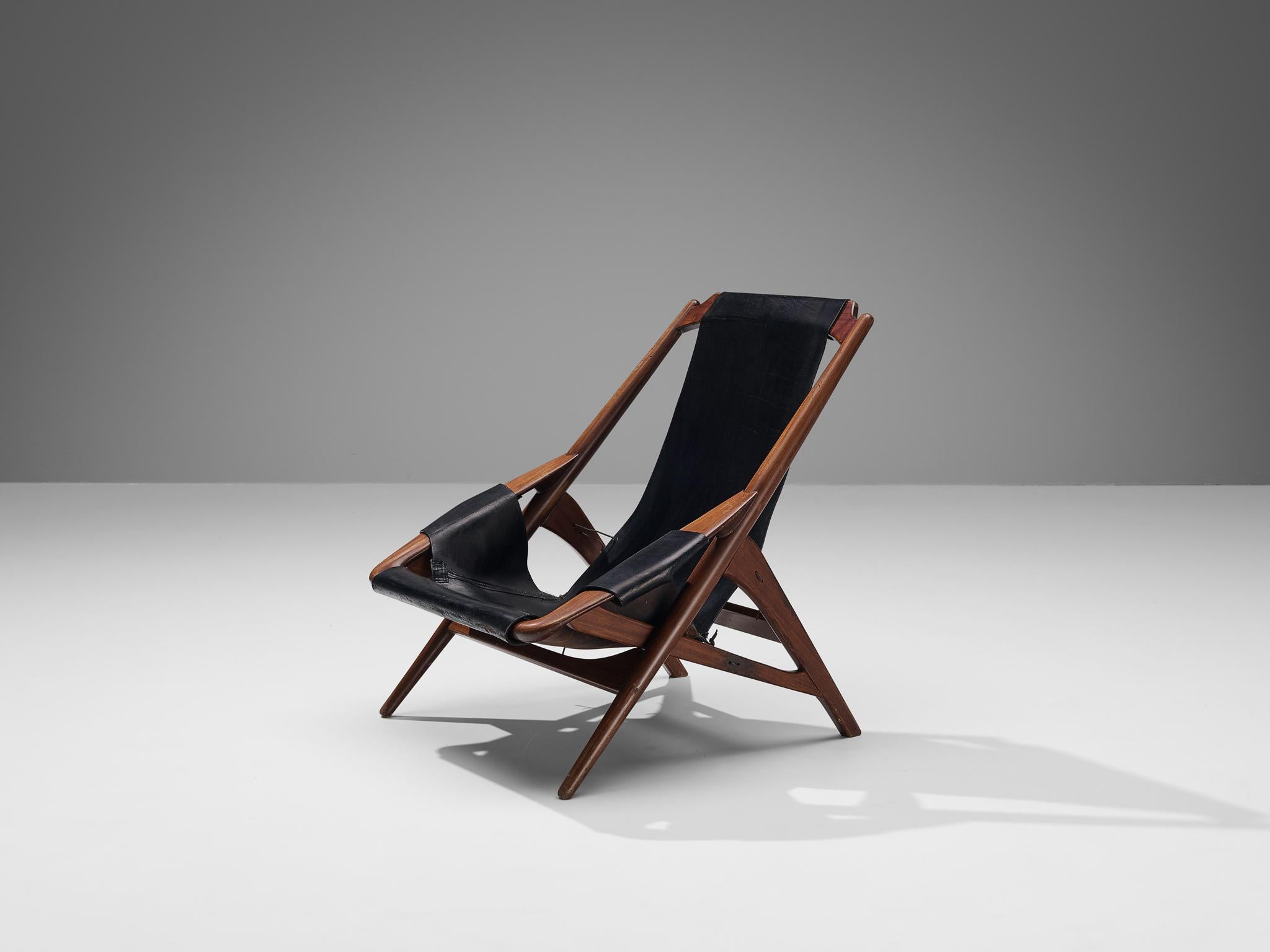 W.D. Andersag, lounge chair, teak, leather, steel, Italy, 1960s

Beautiful armchair designed by W.D. Ansersag. This design has a very dynamic appearance by means of the sharp lines discernible in the wooden frame. The solid construction reminds of