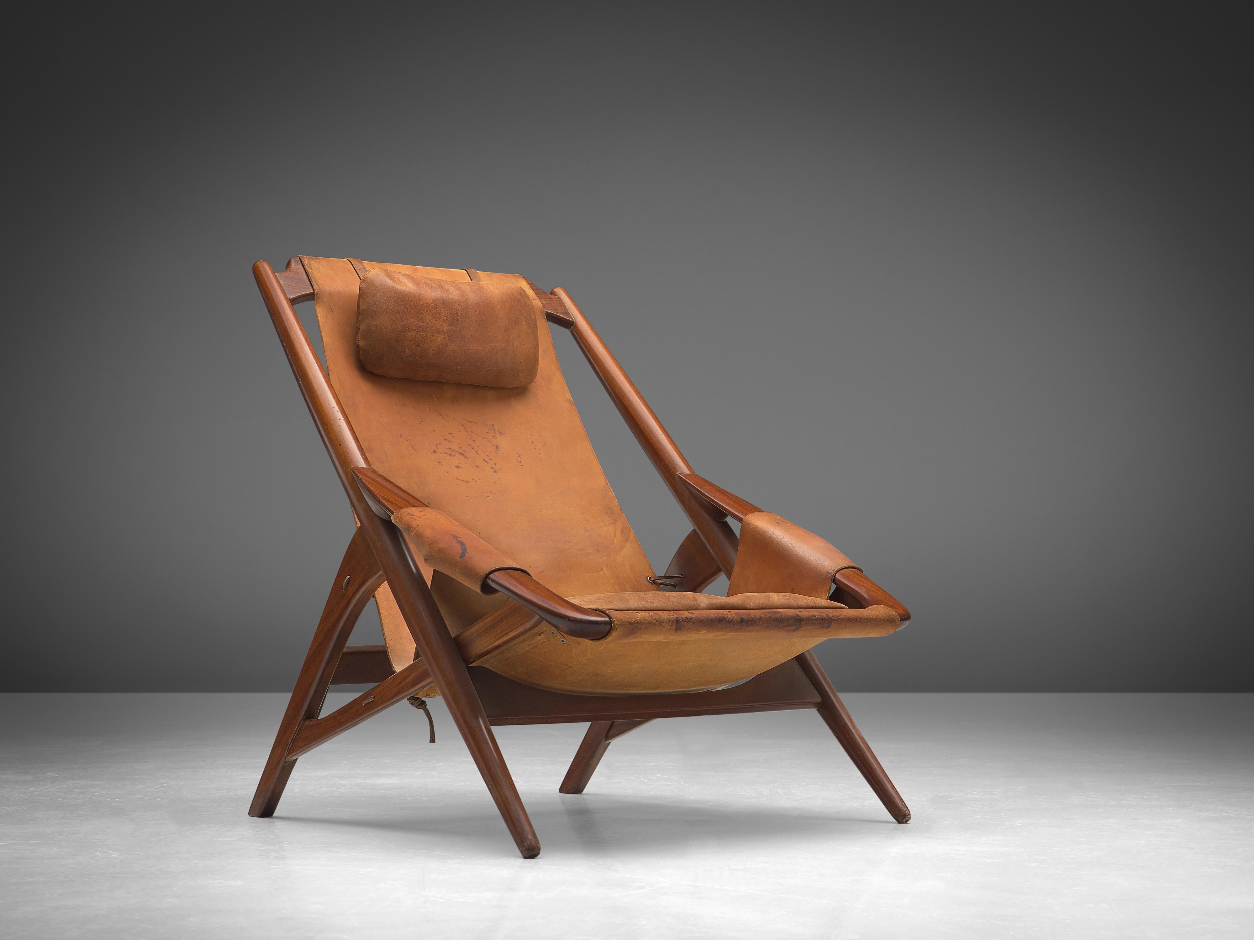 W. Andersag, lounge chair, teak, saddle leather, Italy, 1960s

This chair is very dynamic due it's design and shapes. The teak frame shows beautiful lines. The frame and construction reminds of the sturdy hunting chairs. Thick saddle leather is used