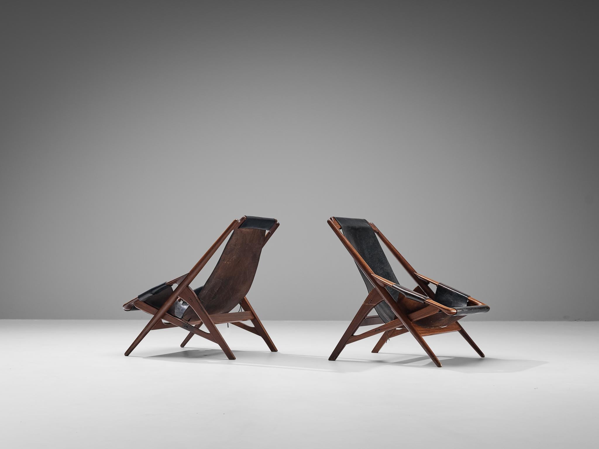 W.D. Andersag, pair of lounge chairs, teak, leather, steel, Italy, 1960s

Beautiful pair of armchairs designed by W.D. Ansersag. This design has a very dynamic appearance by means of the sharp lines discernible in the wooden frame. The solid