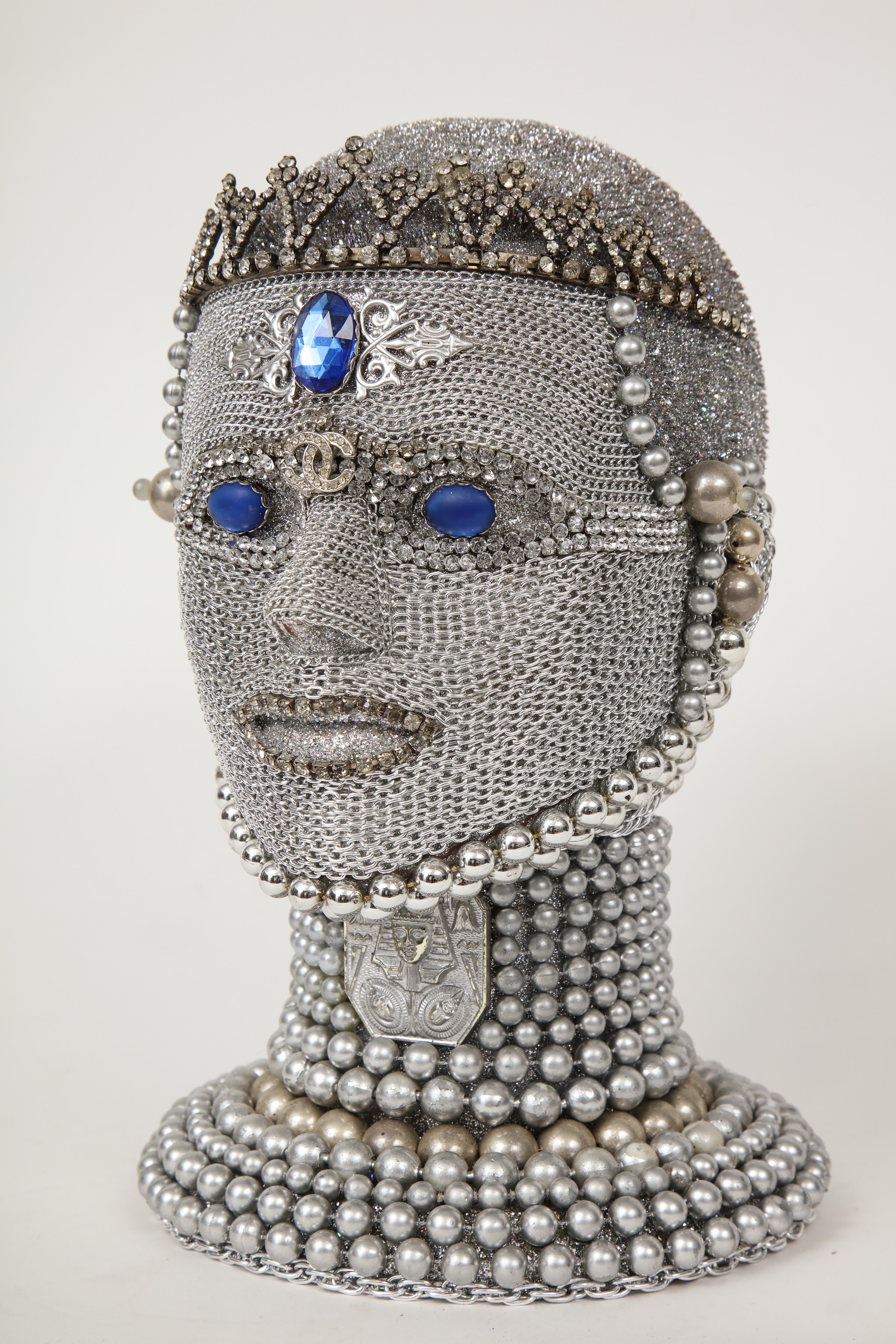 Futuristic android bust with hand applied chain mail and vintage jewelry findings and tiara from New York artist W. Beaupre. Signed.