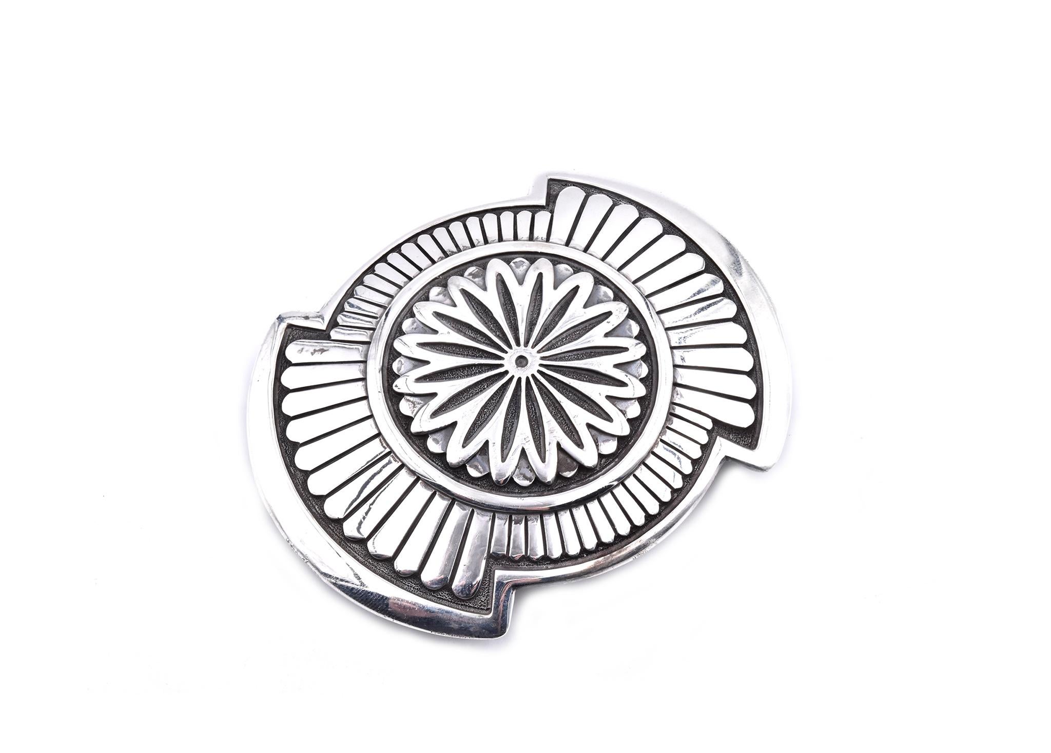 Designer: W. Doran
Material: sterling silver
Dimensions: buckle measures 72.7 X 53.5mm 
Weight: 64.12 grams
