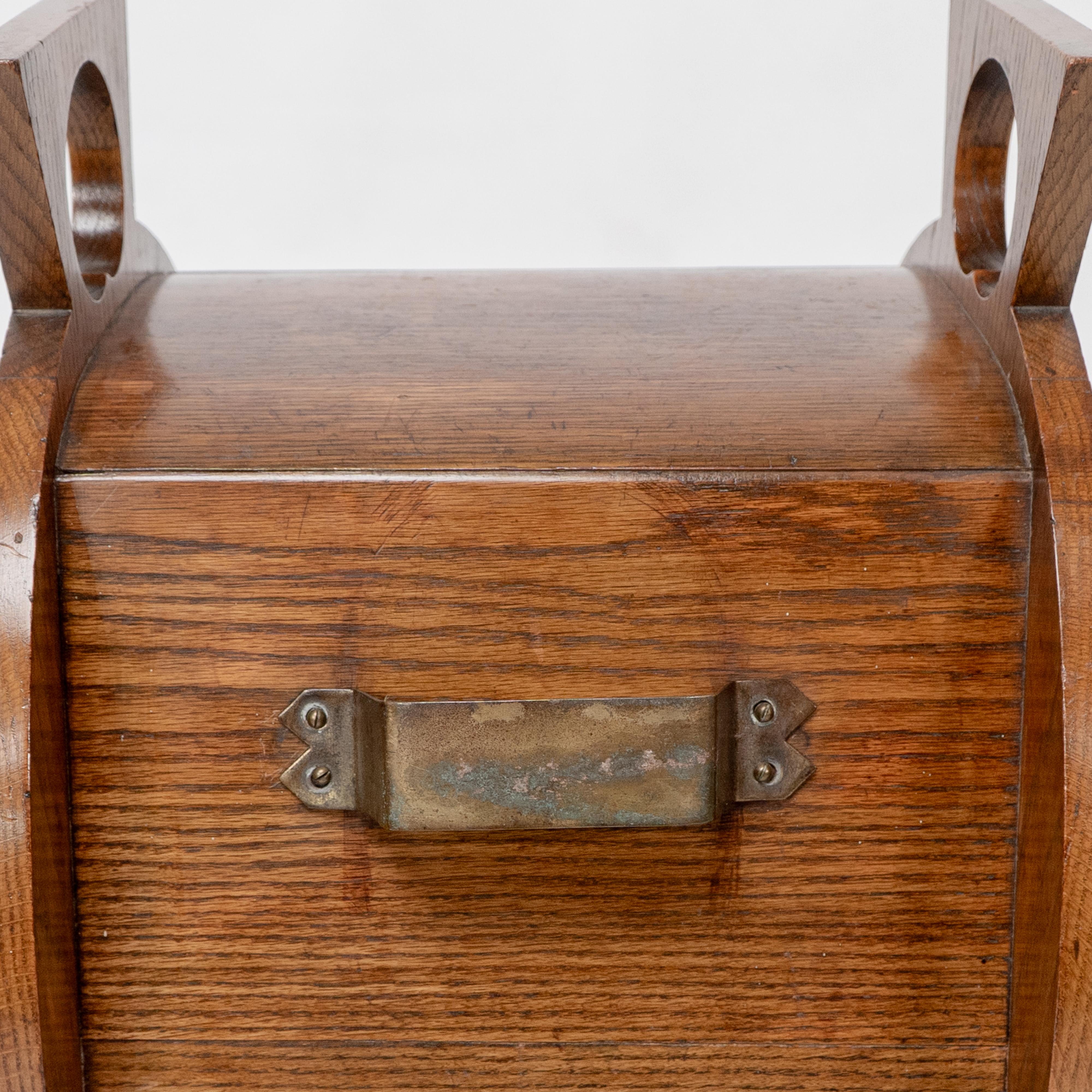 W J Neatby attri. An Arts & Crafts oak coal box with stylized carrying handles For Sale 10