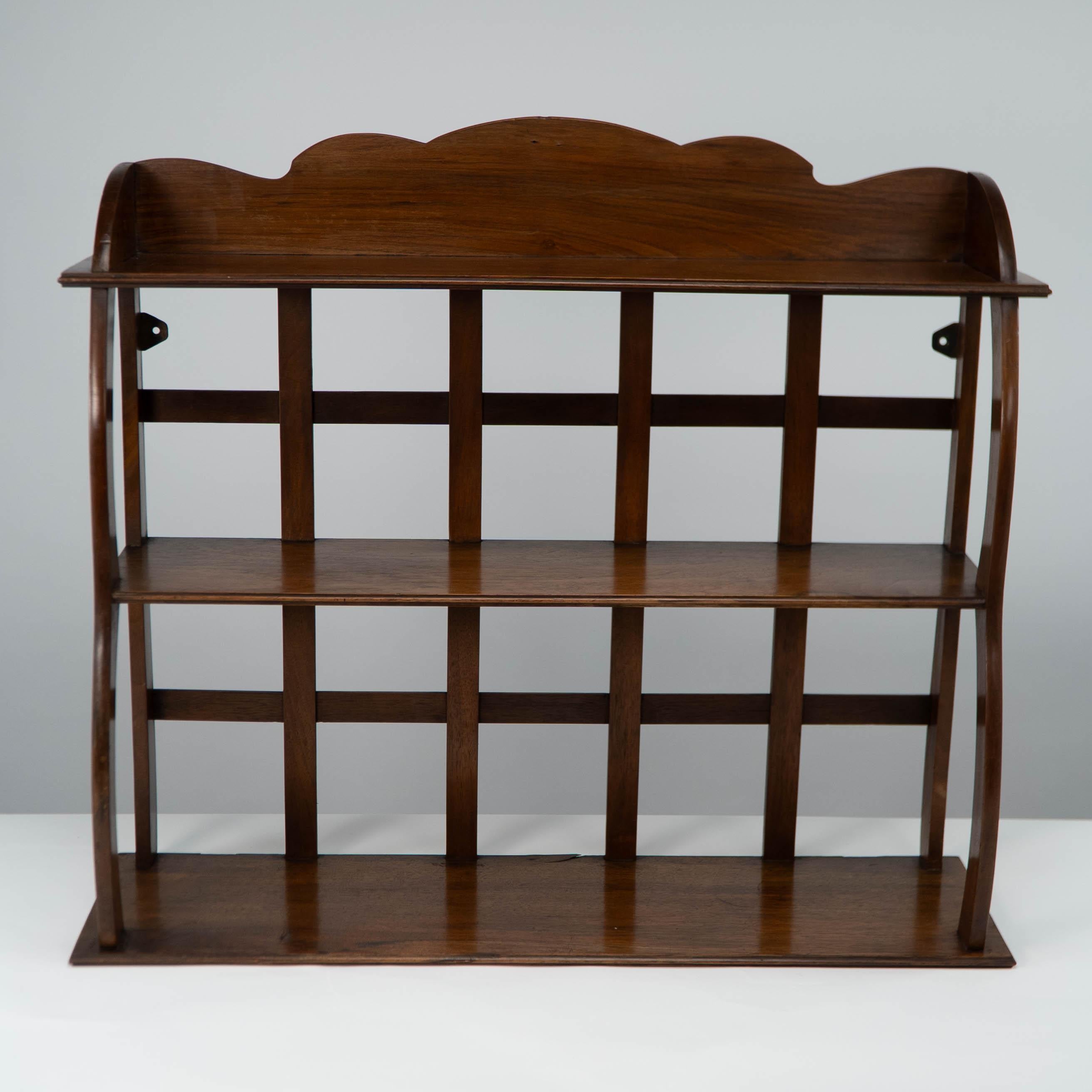 A similar set of shelves, with Lethaby's initials and marked for Kenton & Co (1890-92) sold at Phillips London, 24 March 1987, lot 292.  For another set, exhibited by Kenton & Co. at Barnard’s Inn, London in 1891, see Frances Collard, ‘Kenton & Co’,
